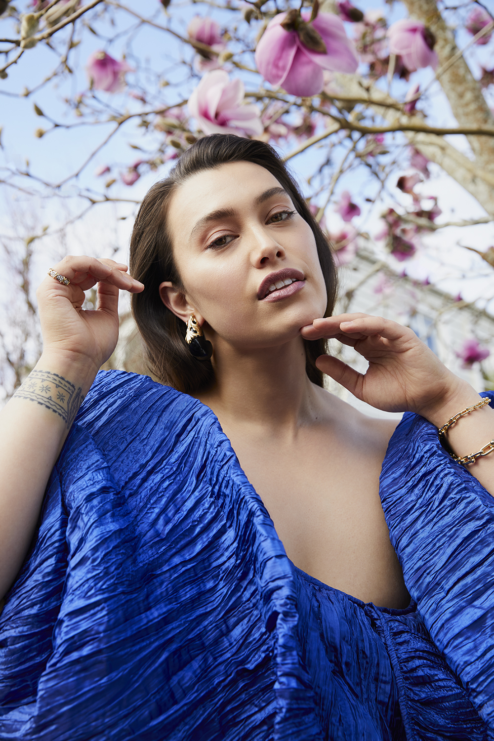 Isabella wears Havilah dress $803. Les Bernard vintage earrings, $529, from Love & Object. Tiffany & Co. diamond band $39,100 and bracelet wrap $5050. Photo / Mara Sommer