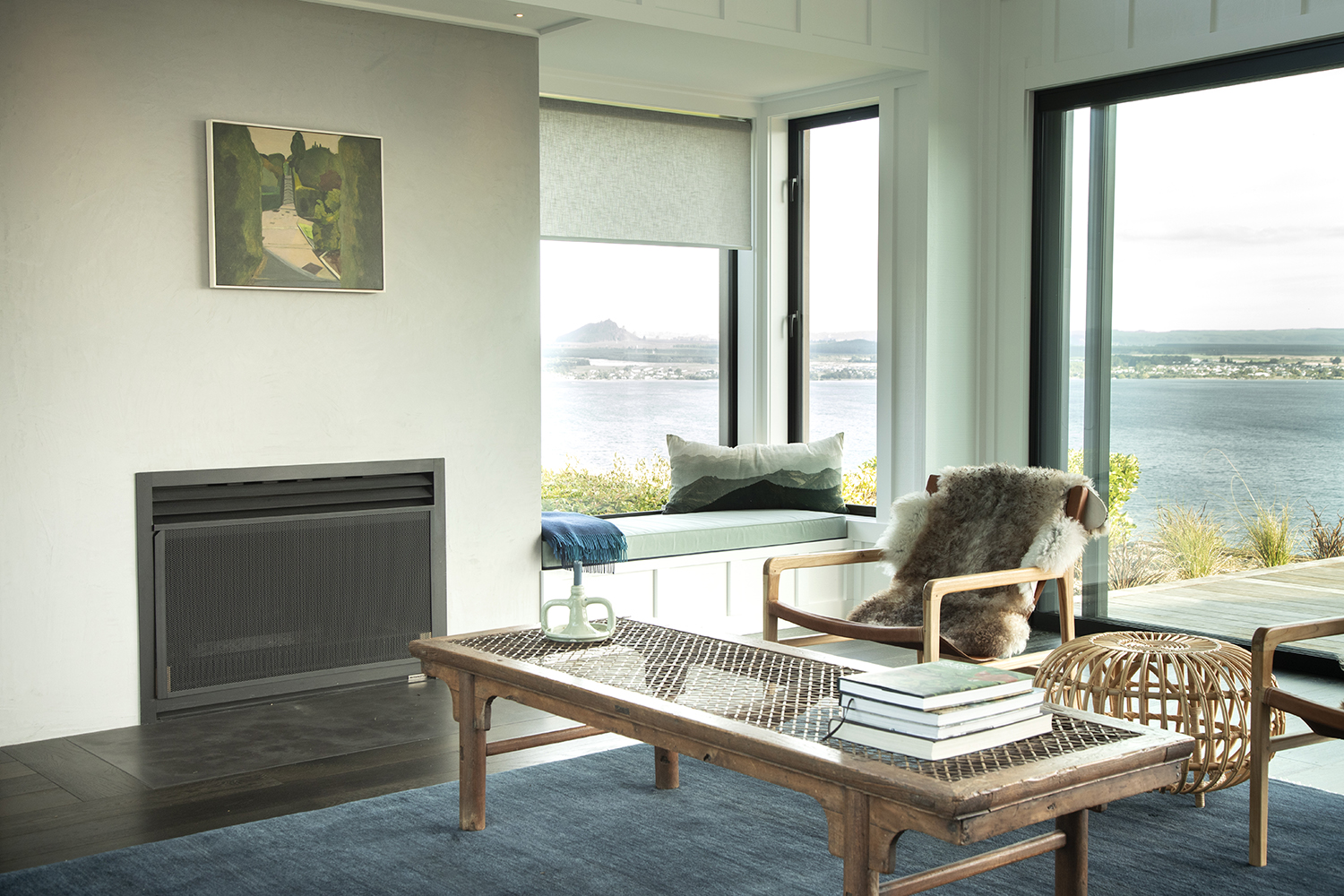 Blue tones combine in the living room. Photo / Ginny Fisher