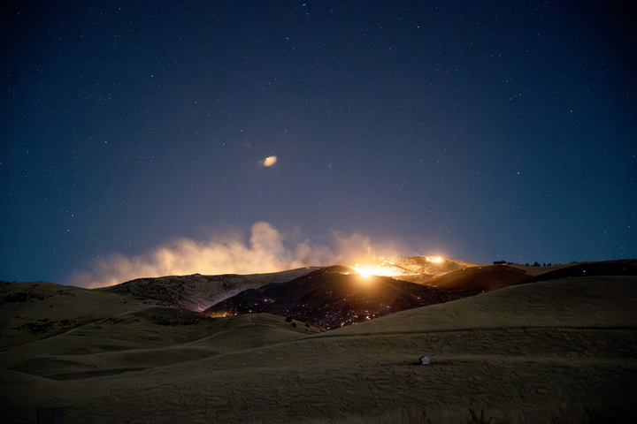 Fifteen crews were battling the fire last night and two helicopters are on standby to join them this morning. Photo / George Heard