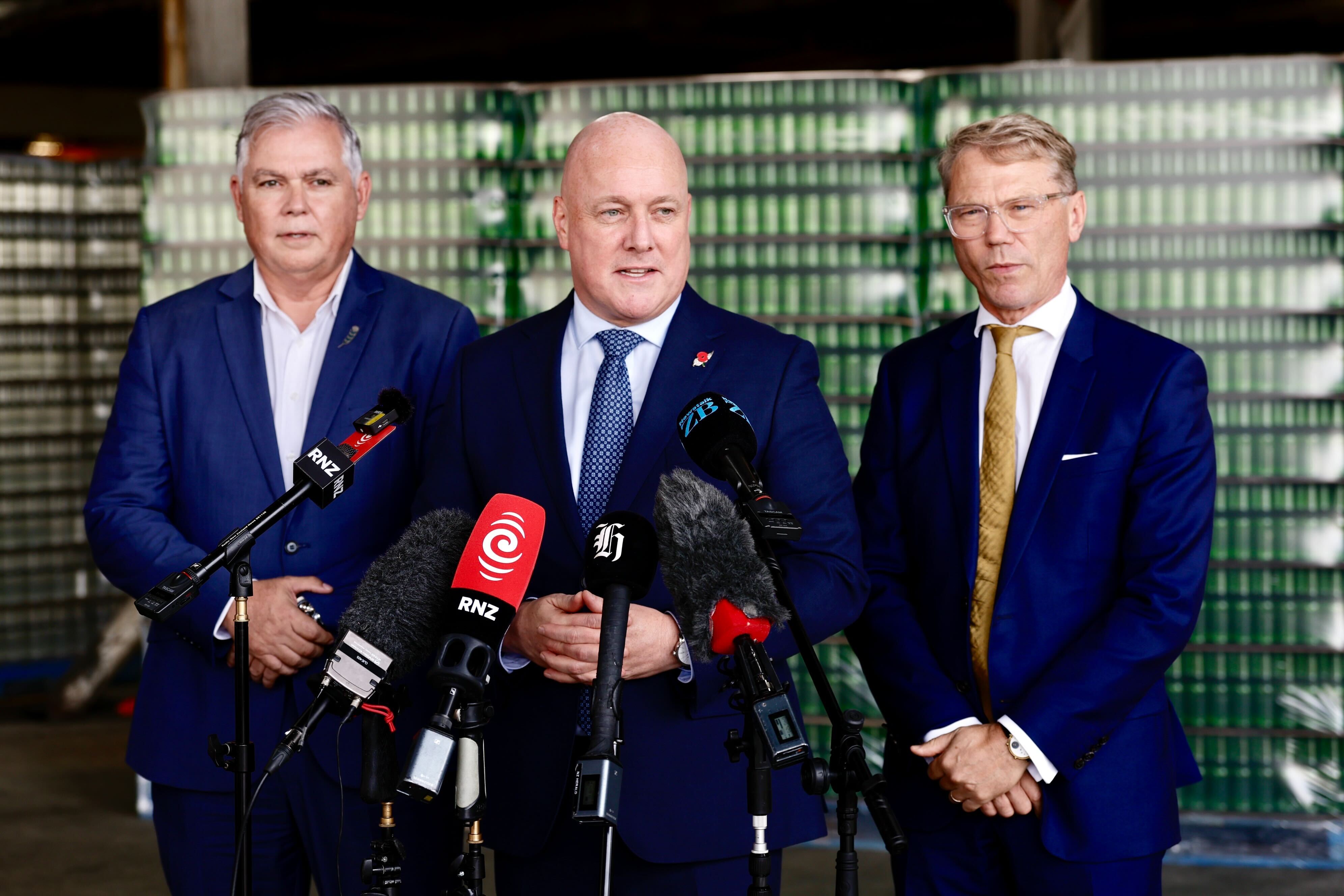 Prime Minister Christopher Luxon flanked by Police Minister Mark Mitchell (left) and Justice Minister Paul Goldsmith. Photo / Dean Purcell