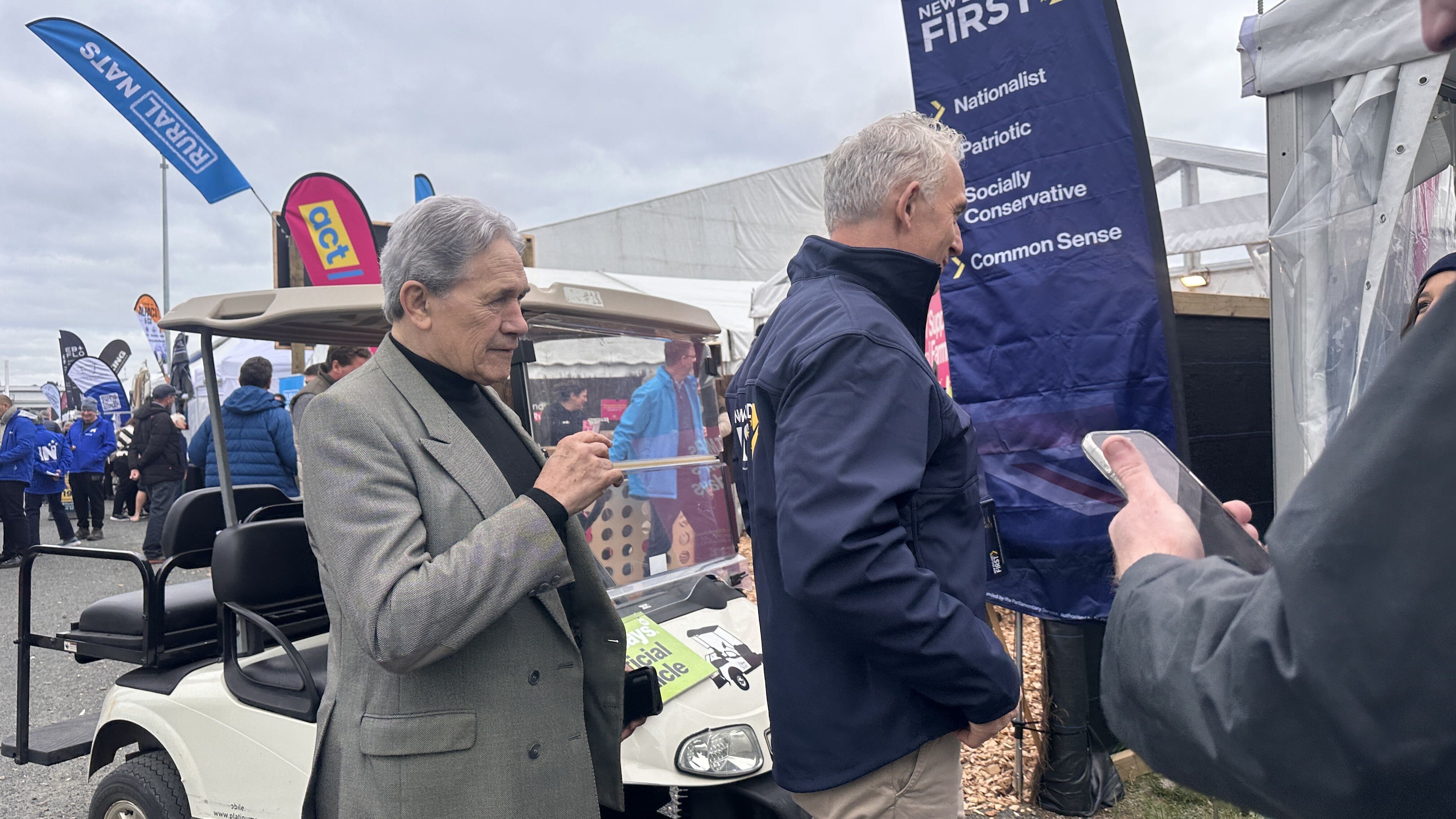 NZ First leader Winston Peters inspected the back of Stuart Nash's jacket. Photo / Jamie Ensor