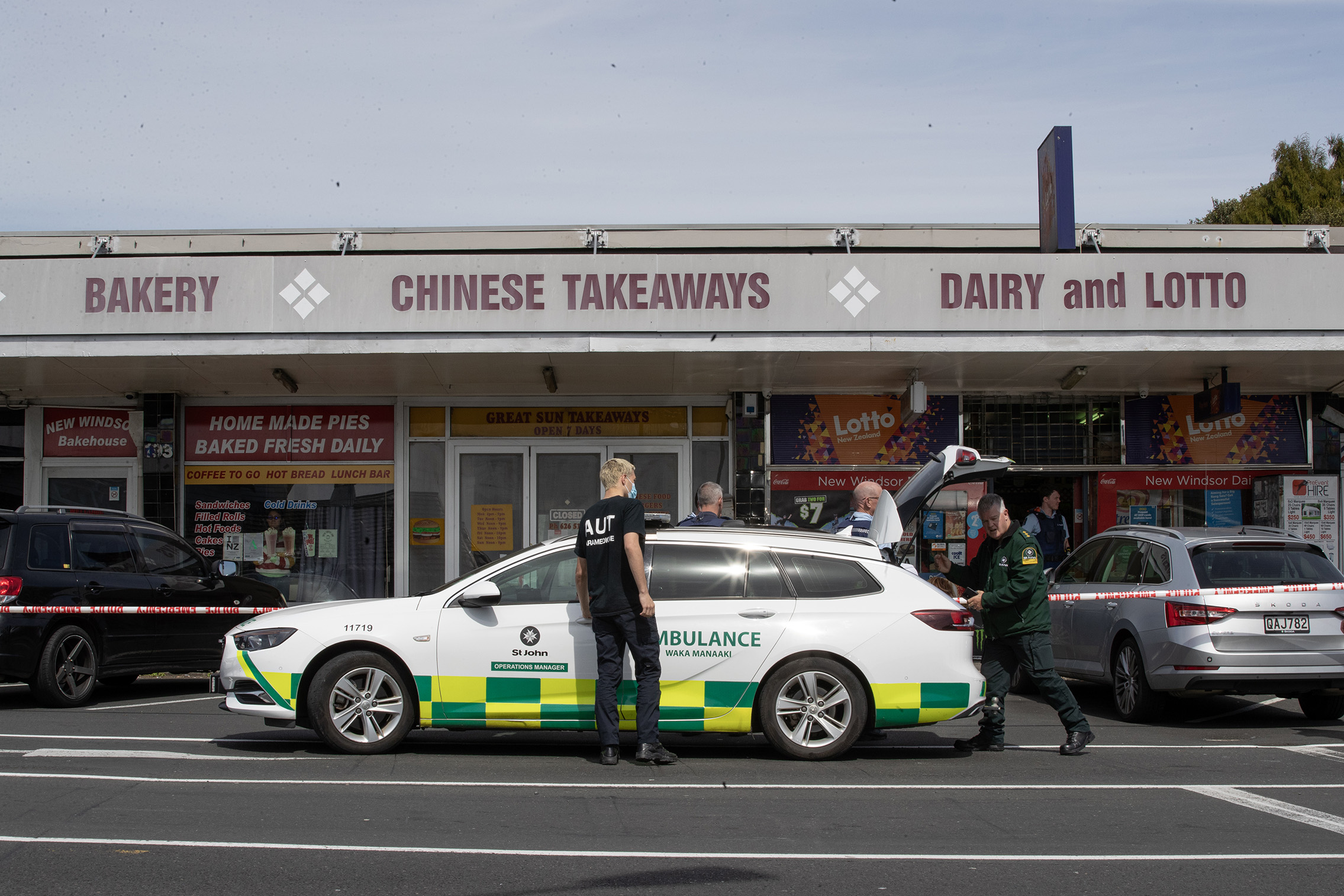 Two people were taken to hospital, one in a critical condition, after a violent incident at an Auckland dairy this morning. Photo / Hayden Woodward