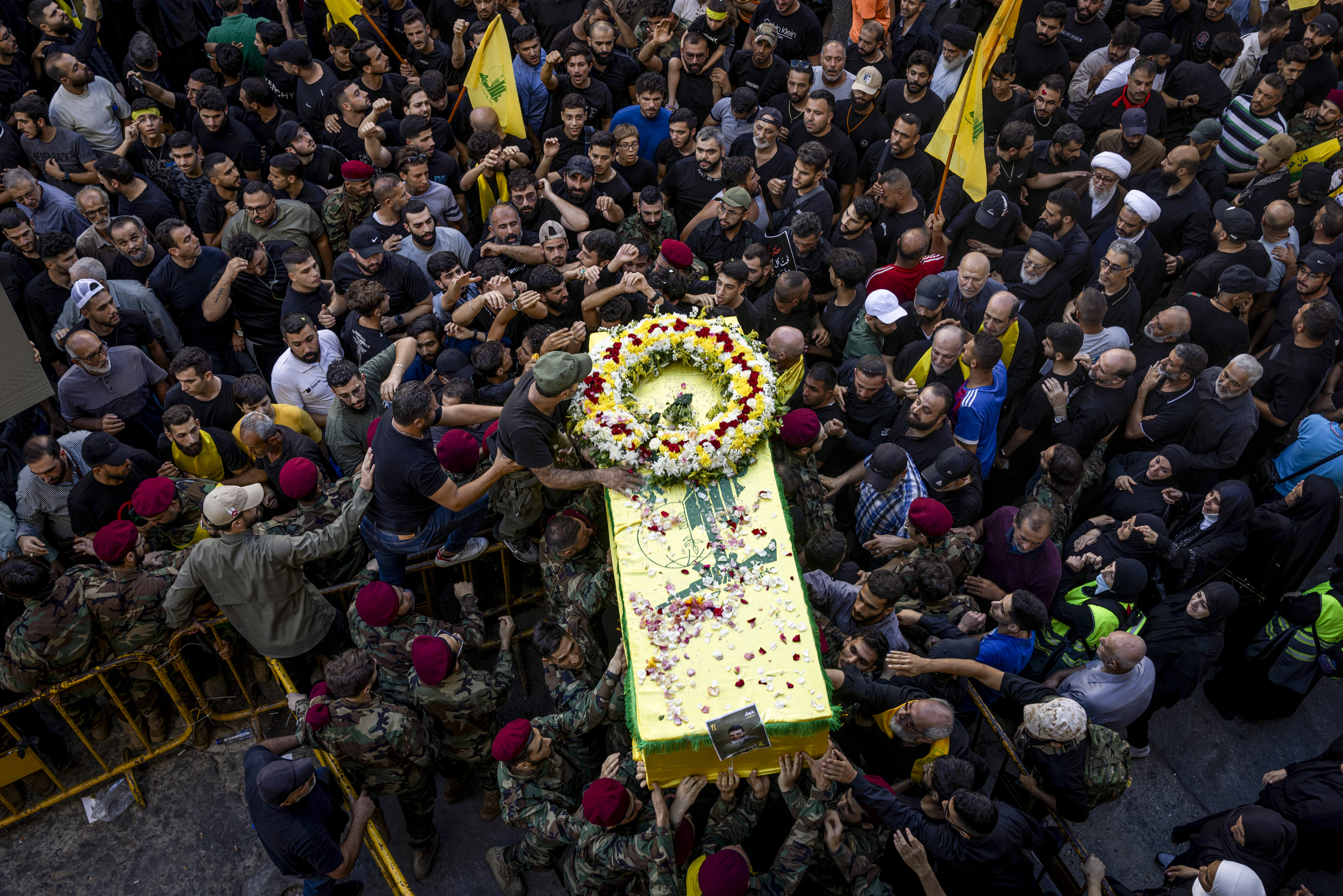 Mourners walk with a coffin during a funeral for four people killed in the pager attack, in Beirut. Photo / Diego Ibarra Sánchez, The New York Times