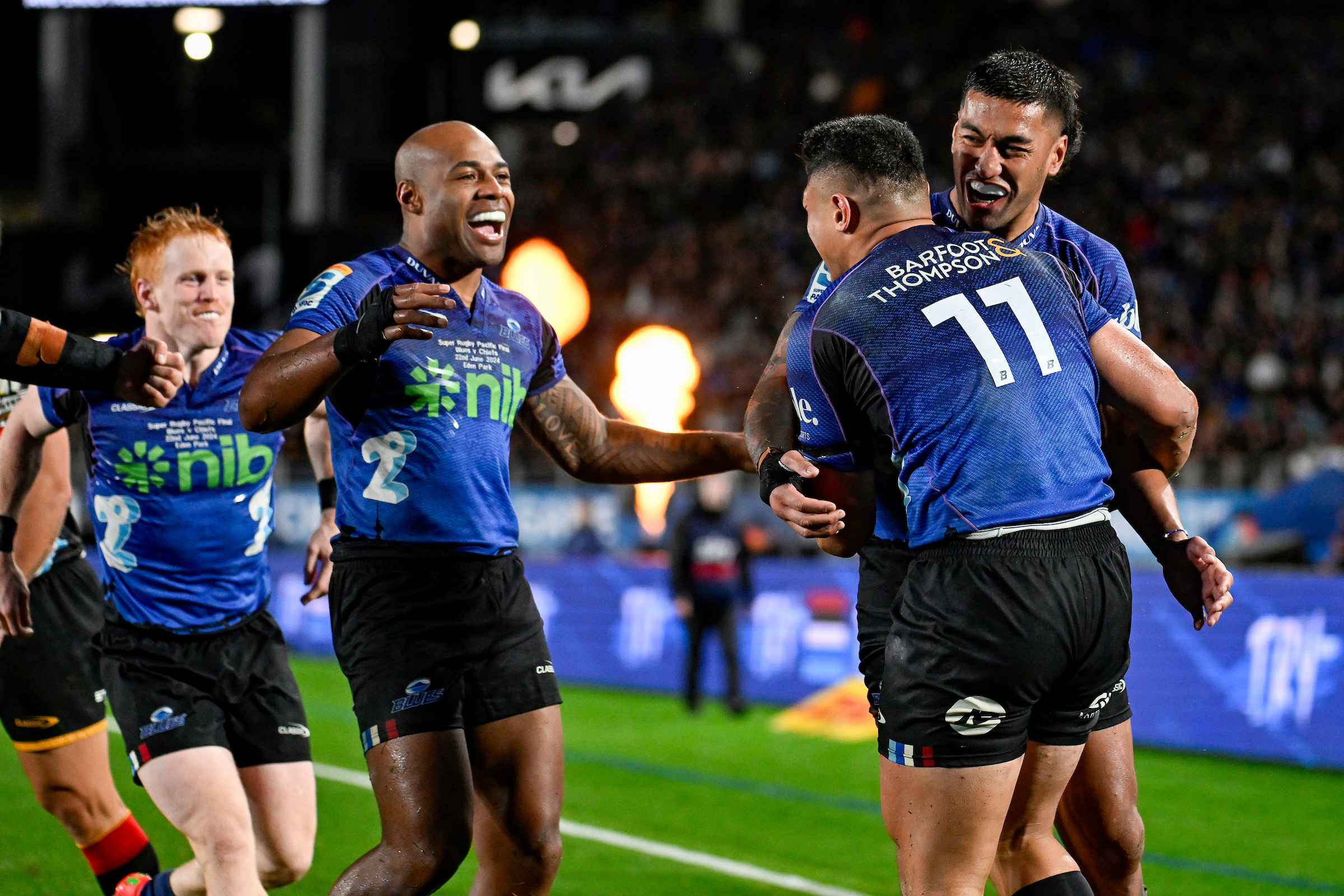 Caleb Clarke of the Blues celebrates one of his three tries with Rieko Ioane and Mark Telea in the Super Rugby Pacific Final at Eden Park. Photo / Photosport