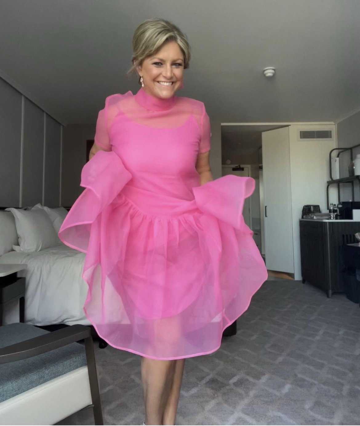 Toni Street wears her pink Staud dress.