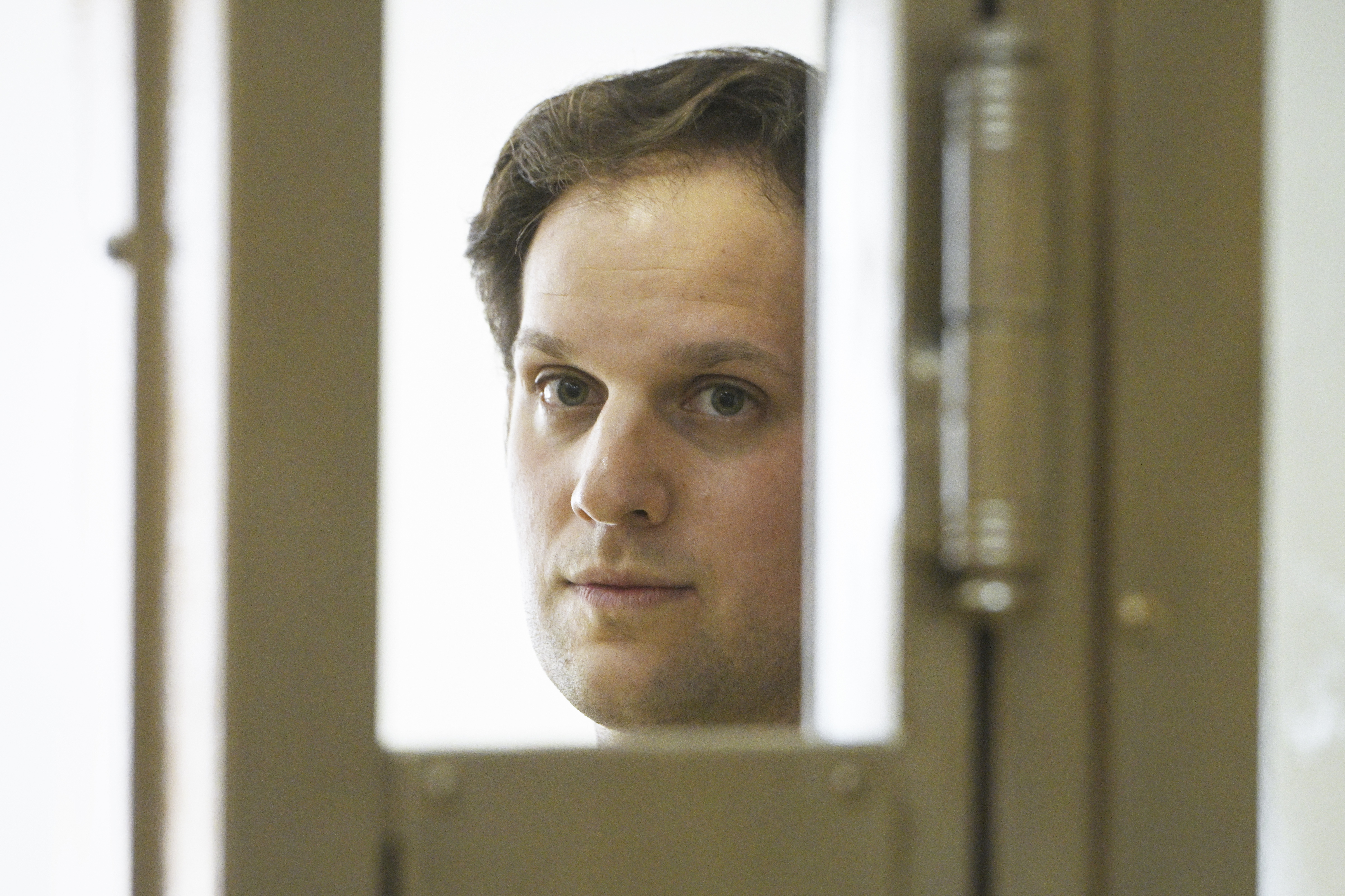 Wall Street Journal reporter Evan Gershkovich stands in a glass cage in a courtroom at the Moscow City Court in Moscow on June 22, 2023. Gershkovich, a reporter detained on espionage charges in Russia, appeared in court Thursday to appeal his extended detention. Photo / AP