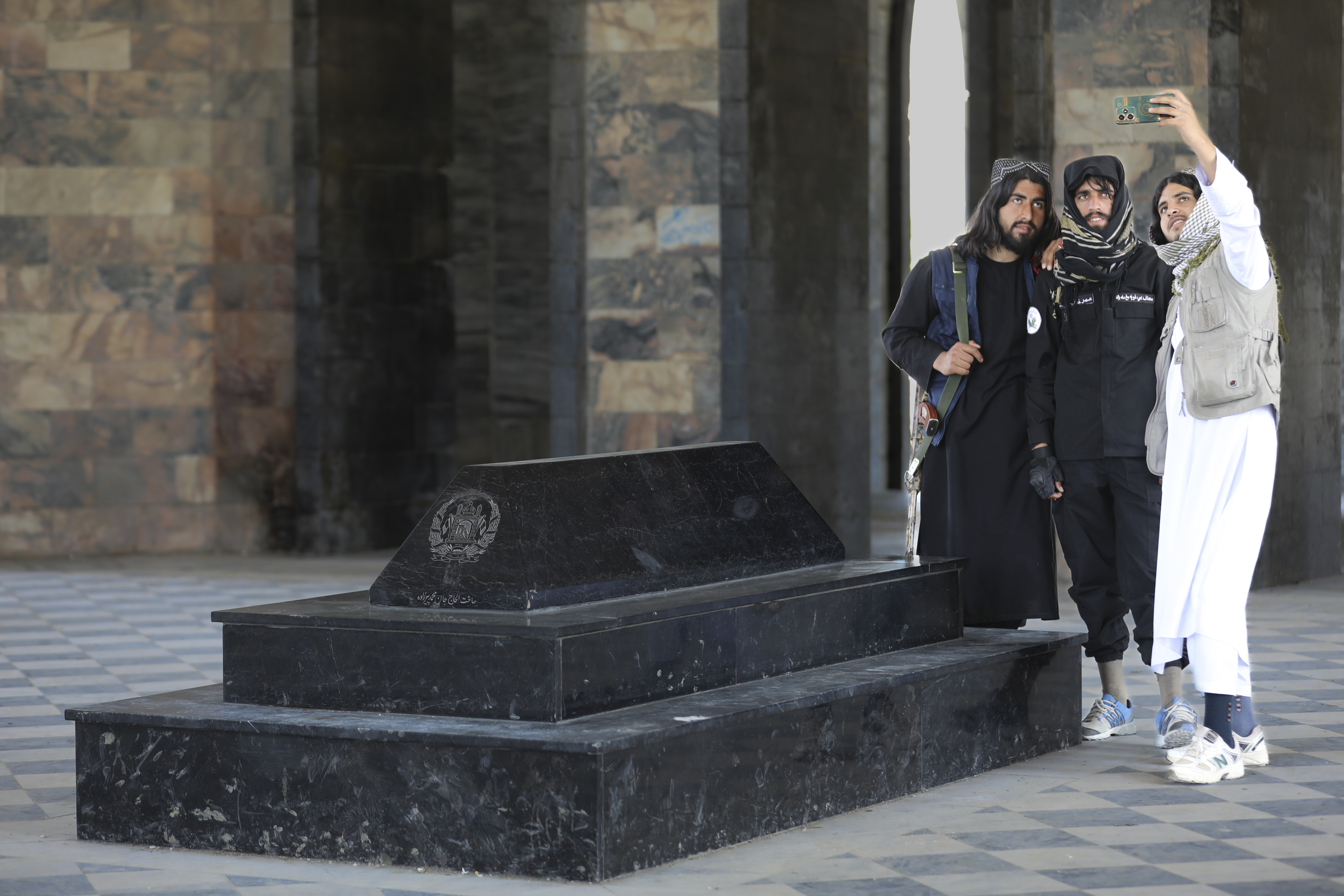 Taliban fighters take selfies by the tomb of Afghan Kind Nadir Shah in Kabul, Afghanistan. Photo / AP