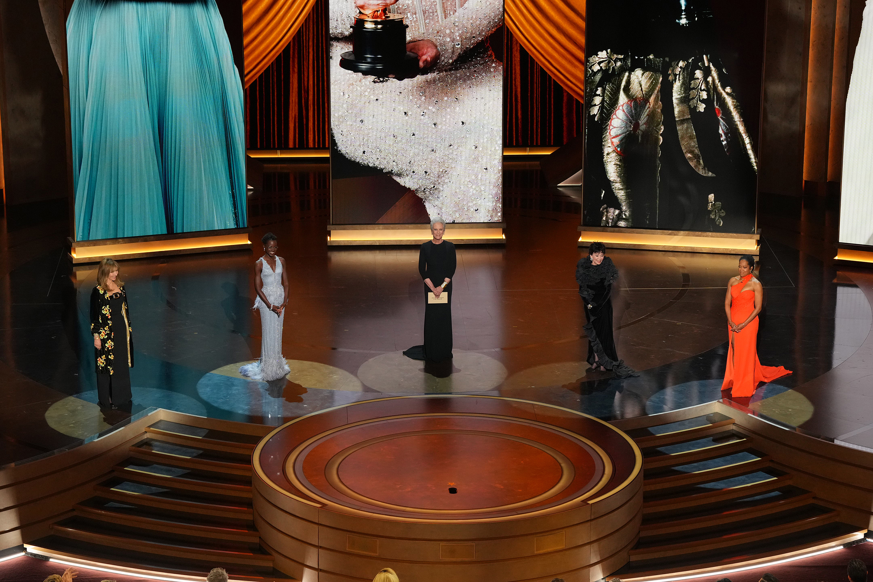 Flanked by fellow supporting-actress winners Jamie Lee Curtis and Regina King, Rita Moreno introduces America Ferrera. Photo / Amir Hamja, The New York Times
