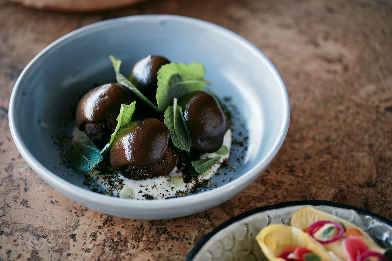 Cauliflower balls with sticky coffee vinegar. Photo / Babiche Martens
