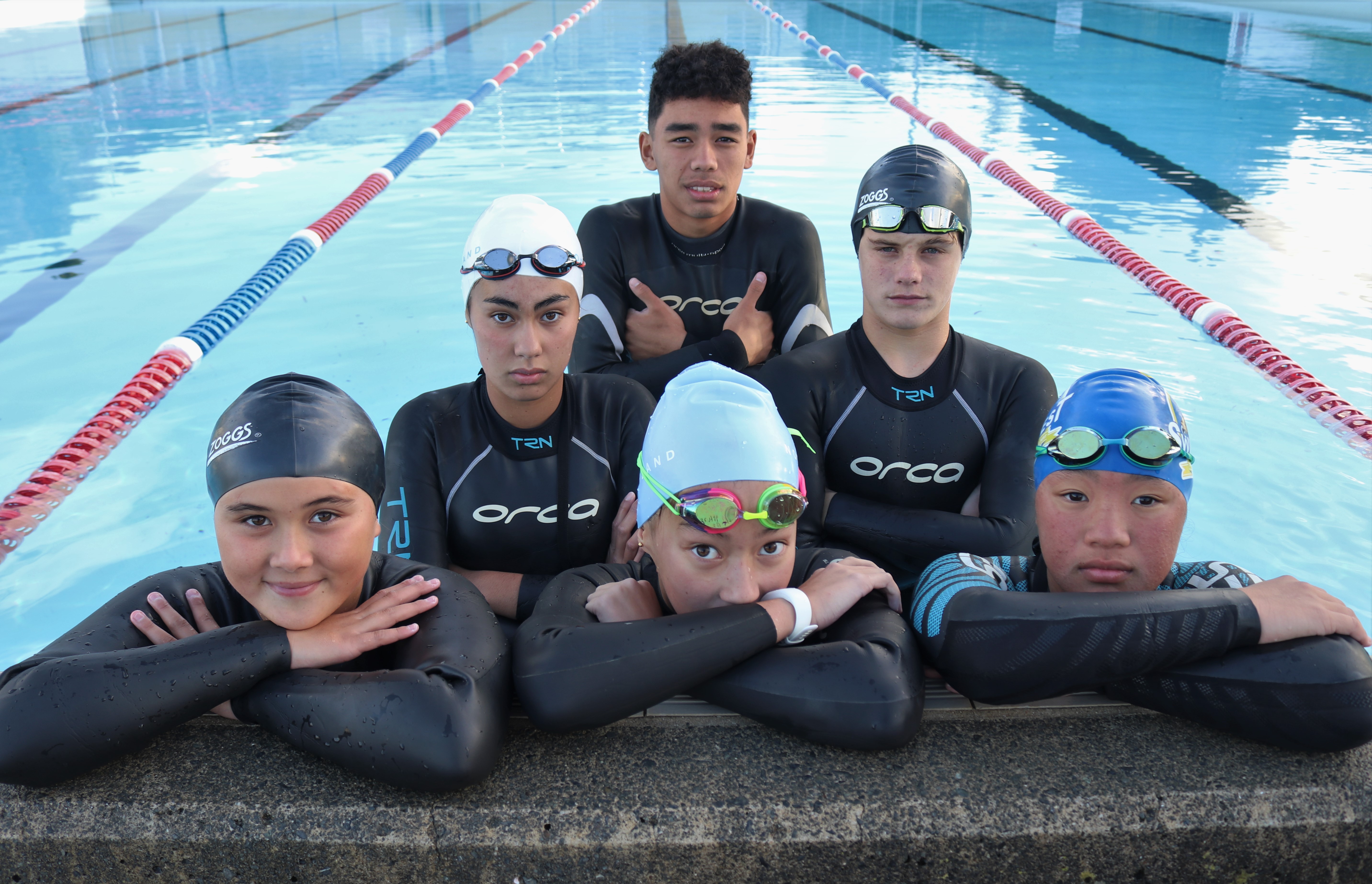 (From left): Trying to stay warm in Kerikeri’s outdoor pool are Bay of Islands Swimming Club members Kiki Shimozono, 10, Sascha Bell, 15, Hiro Tau (back), 15, Layla Bell (front), 12, Sebastian Mottl, 15, and Sakura Tau, 13. Photo / Peter de Graaf