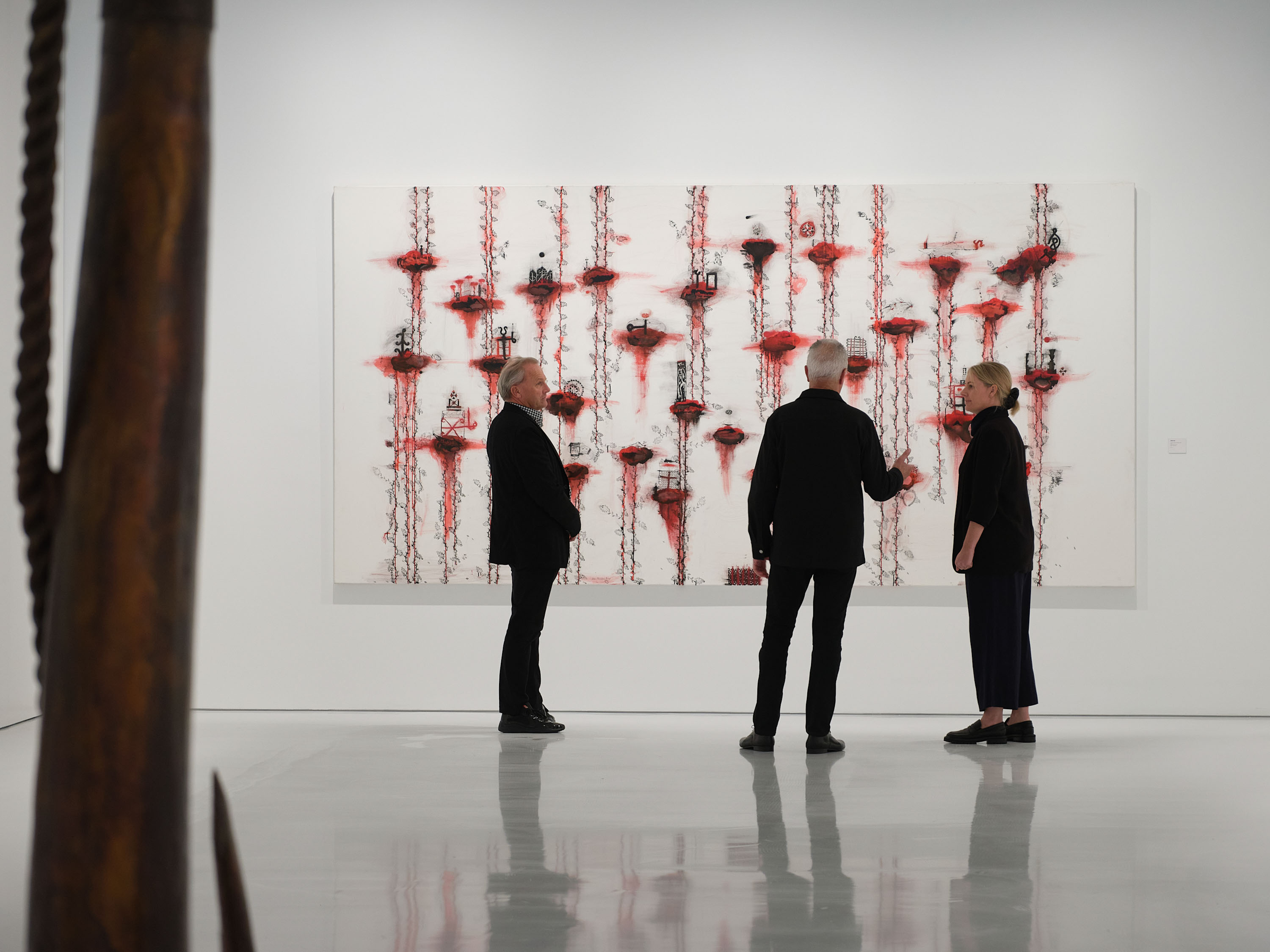 Gow Langsford gallery directors John Gow, Gary Langsford and Anna Jackson with a painting by John Pule, 'Niniko Lalolagi, Dazzling World', 2004, in their new Onehunga gallery. Photo / Sam Hartnett