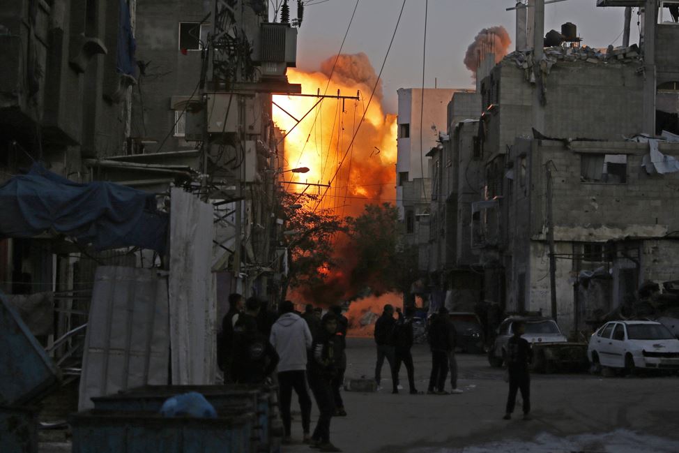 Smoke rises from a building destroyed in Israeli airstrike at the Bureij camp for Palestinian refugees in the central Gaza Strip. Photo / AFP