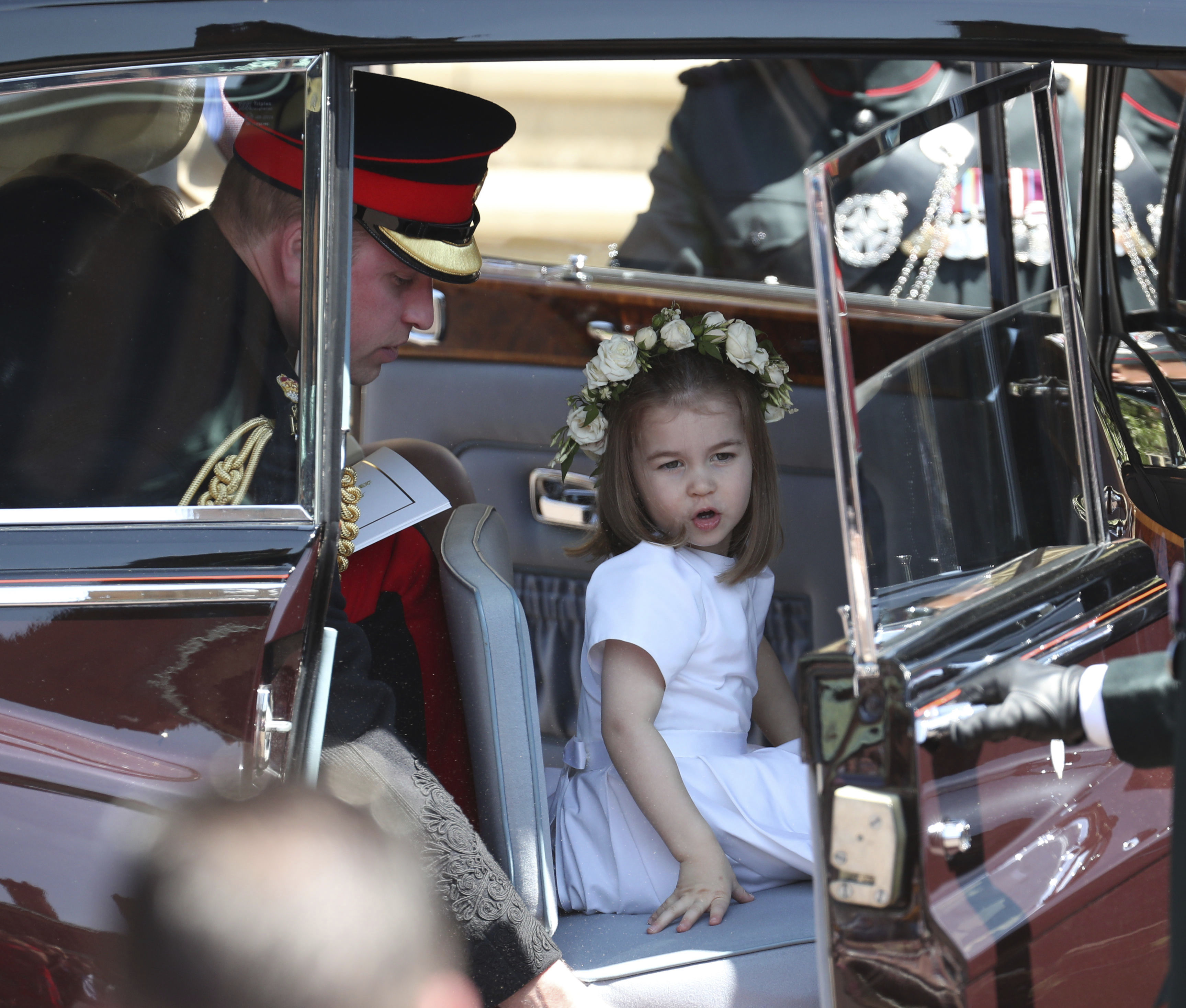 Princess Charlotte and Britain's Prince William leave after the wedding ceremony of Prince Harry and Meghan Markle at St. George's Chapel in Windsor Castle in Windsor. Photo / AP