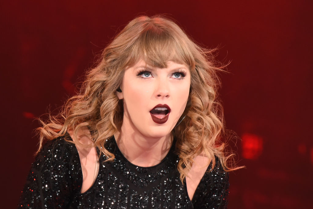 Taylor Swift won her third consecutive artist of the year prize at the American Music Awards, but missed the show because she's busy re-recording her early music. Photo / Getty Images