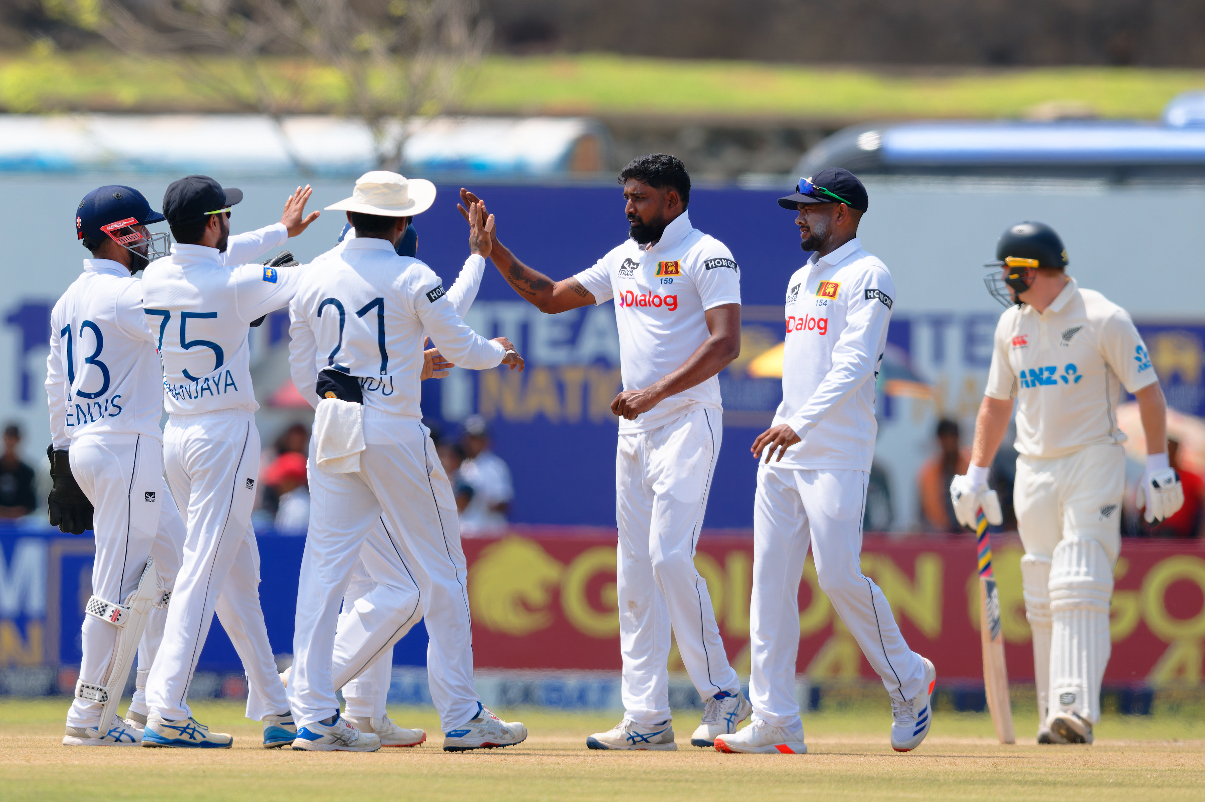 Sri Lanka celebrate a wicket on day three of the first test. Photo / Sri Lanka Cricket