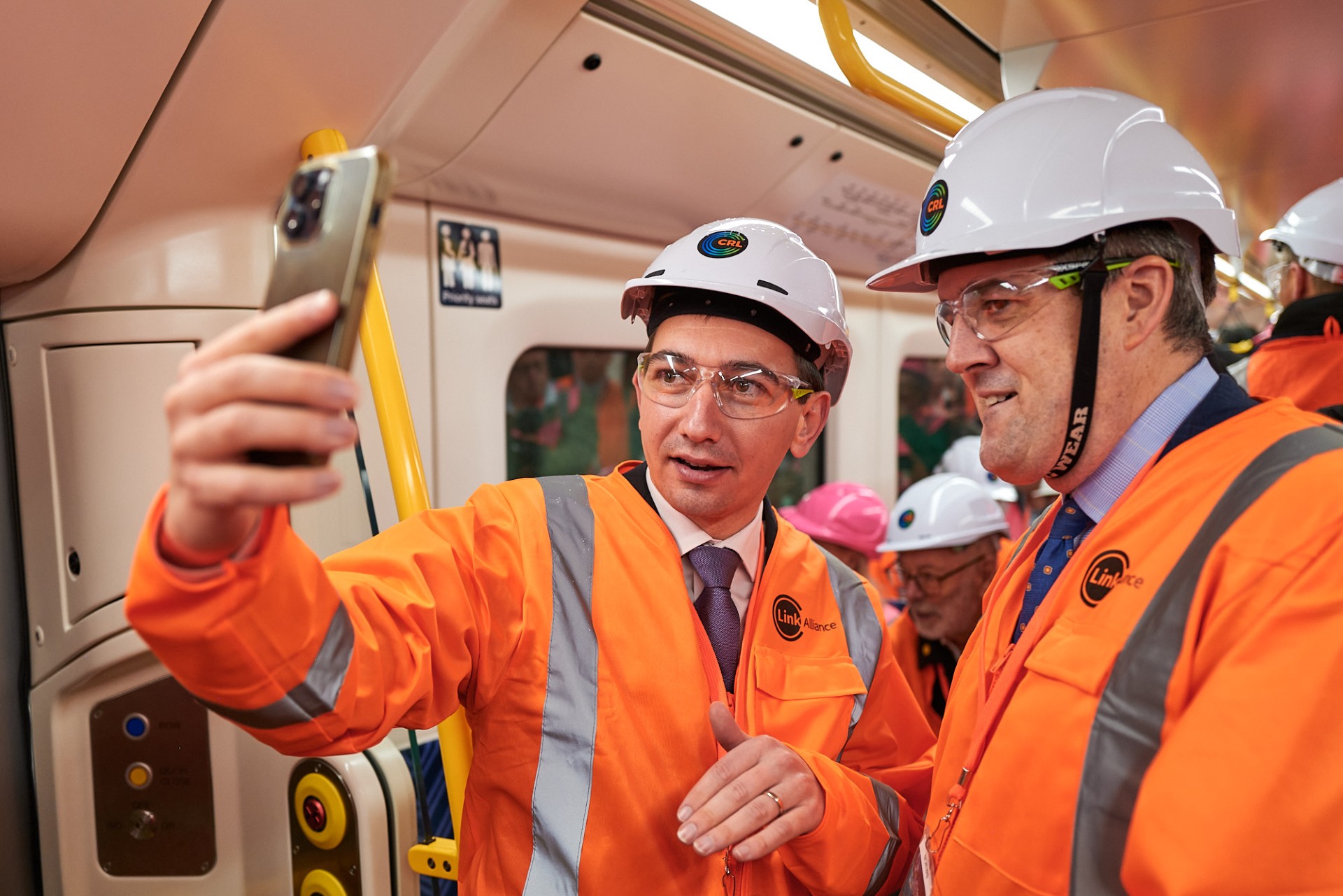Auckland Minister Simeon Brown (left) and Transport Minister Chris Bishop aboard the first passenger train ride on the City Rail Link, in August.