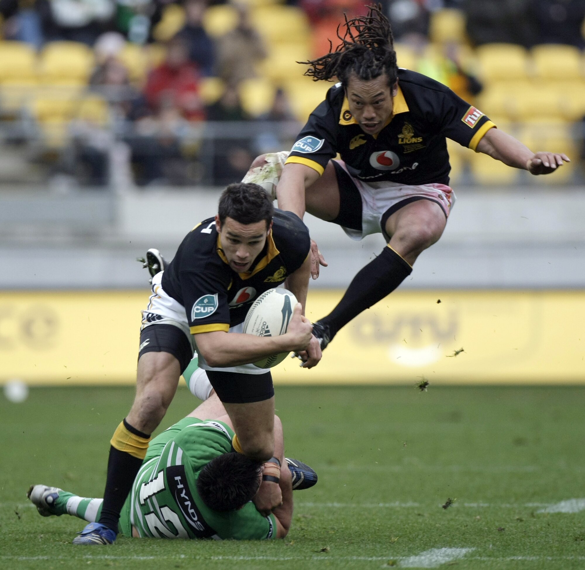 Tamati Ellison runs over the defence with Tana Umaga during an NPC game in 2007. Photo / Photosport
