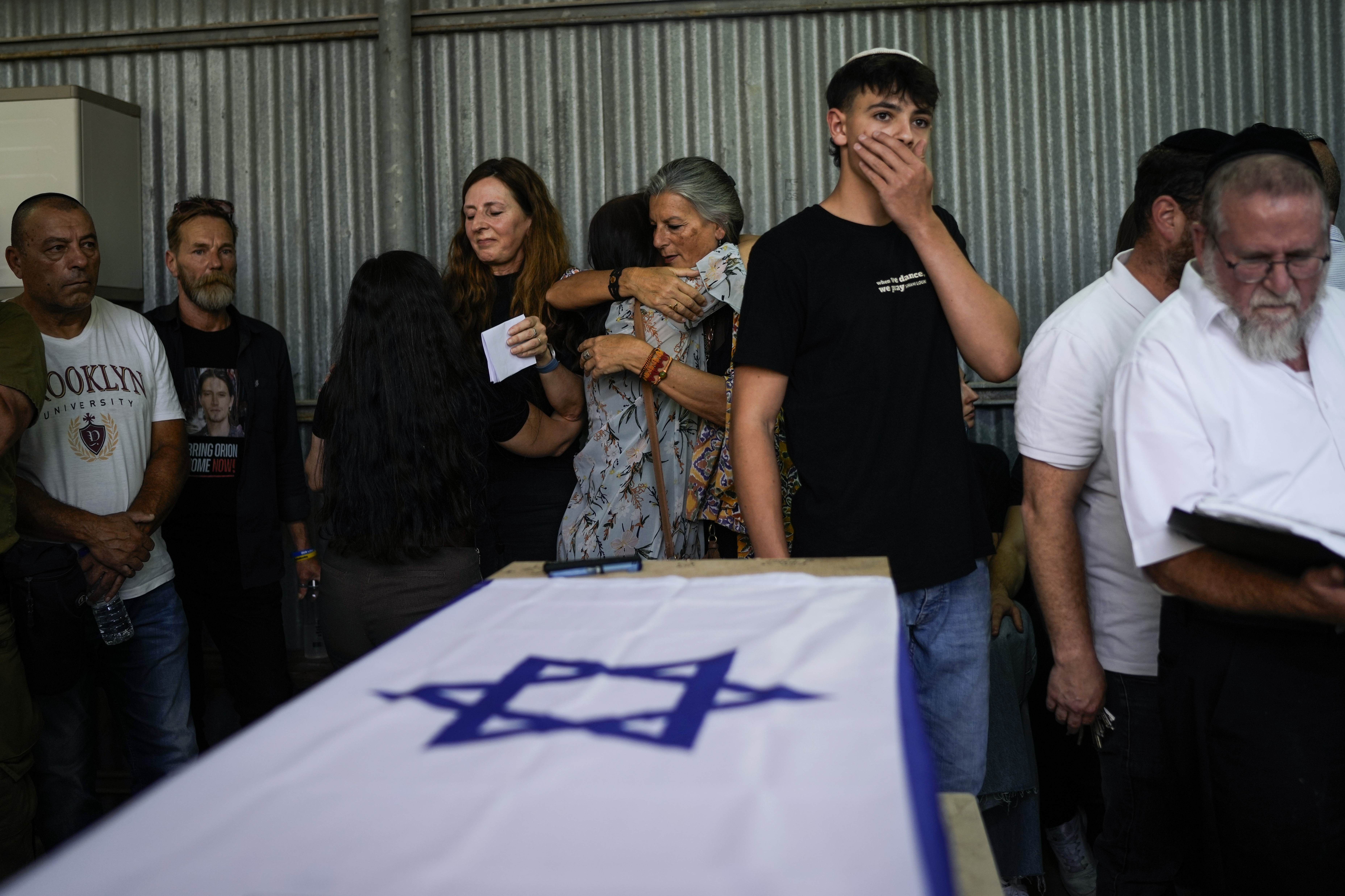 Mourners gather around the flag-covered coffin of Shani Louk during her funeral in Srigim, Israel, on Sunday, May 19, 2024. Photo / AP