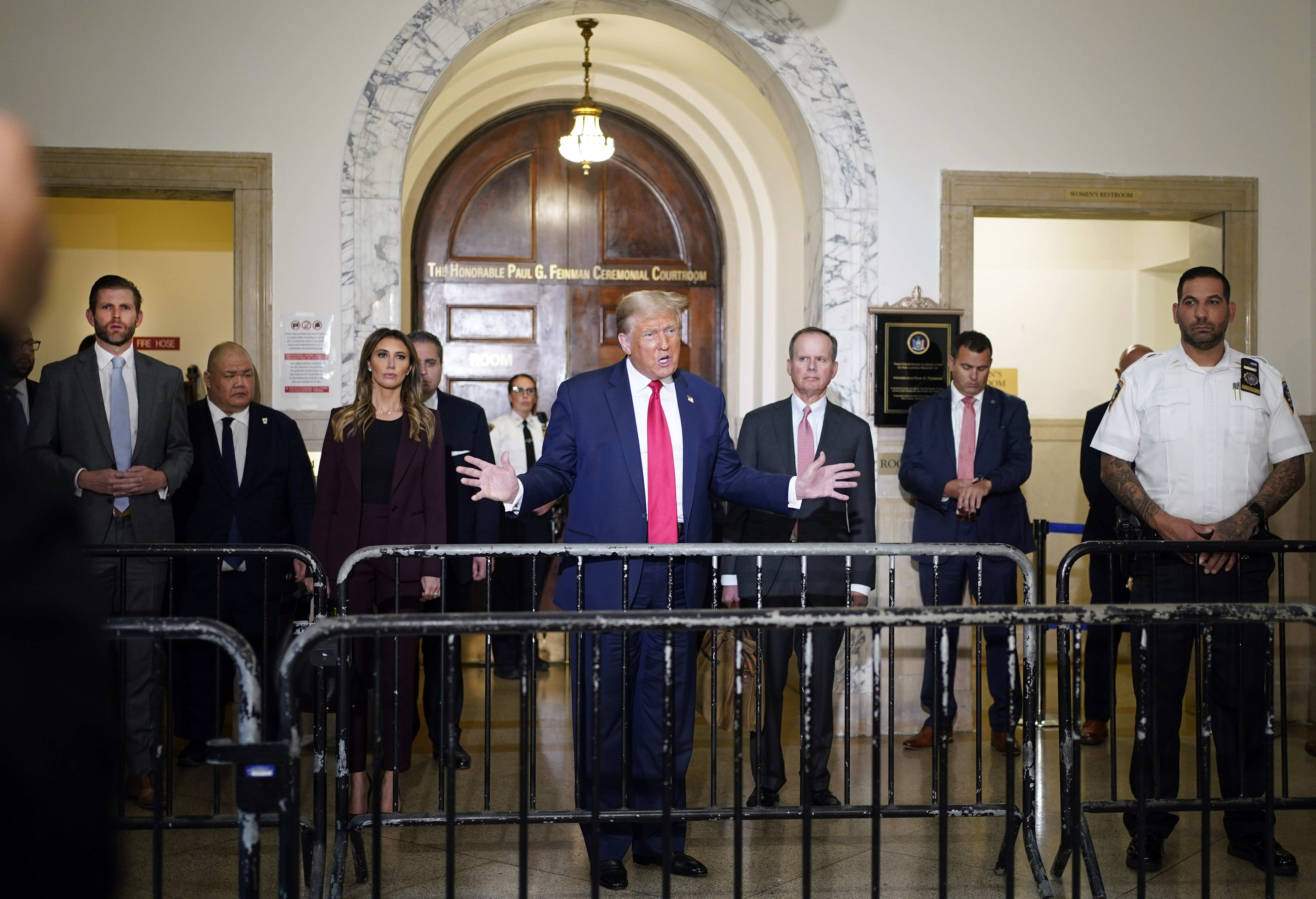 Former US President Donald Trump, centre, seen arriving for his civil business fraud trial at New York Supreme Court last month. Trump's son, Eric Trump, is seen at left. Photo / AP