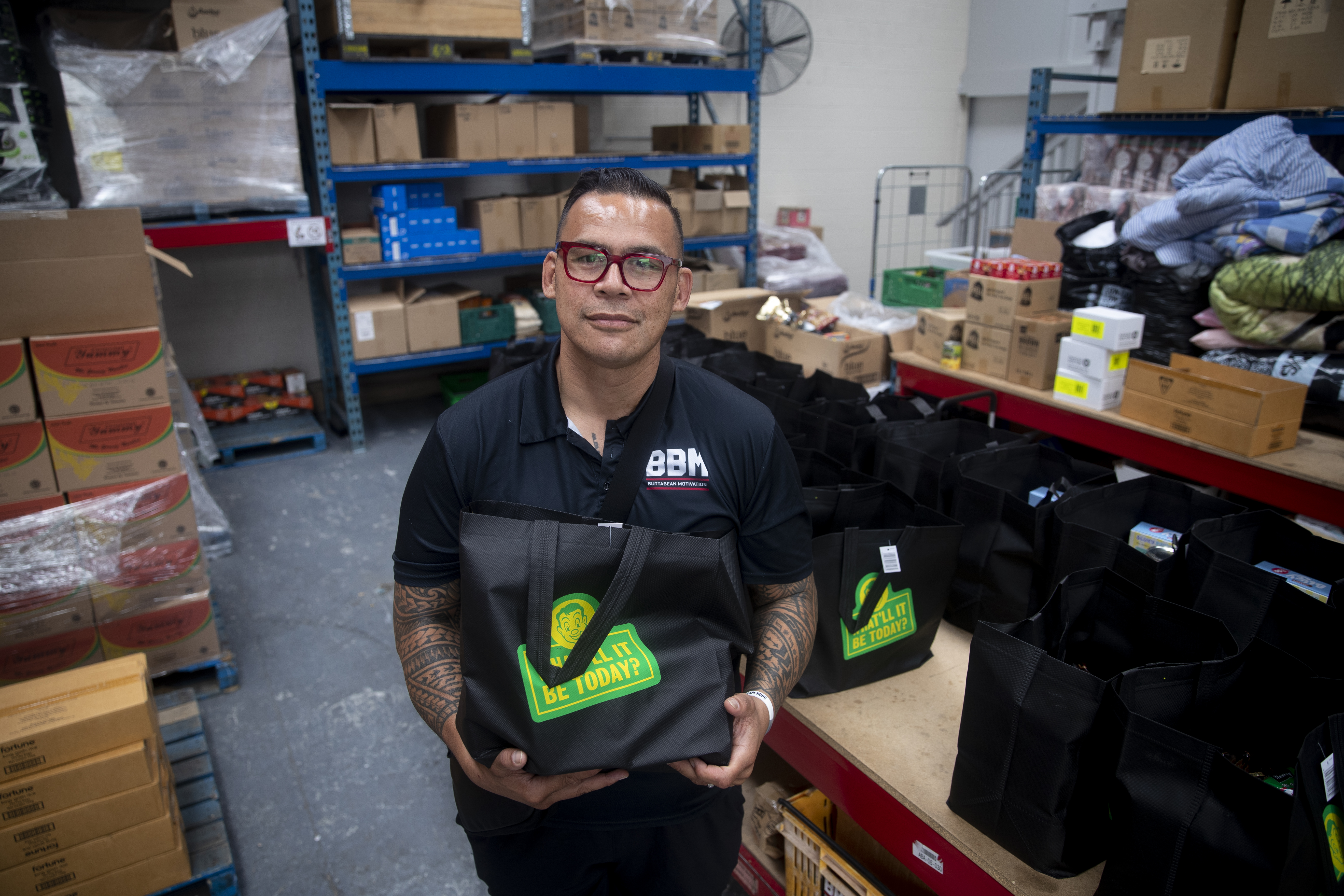 Community leader Dave Letele at work at his food bank in Mangere where he is supporting people who were affected by the Auckland floods. Photo / Dean Purcell
