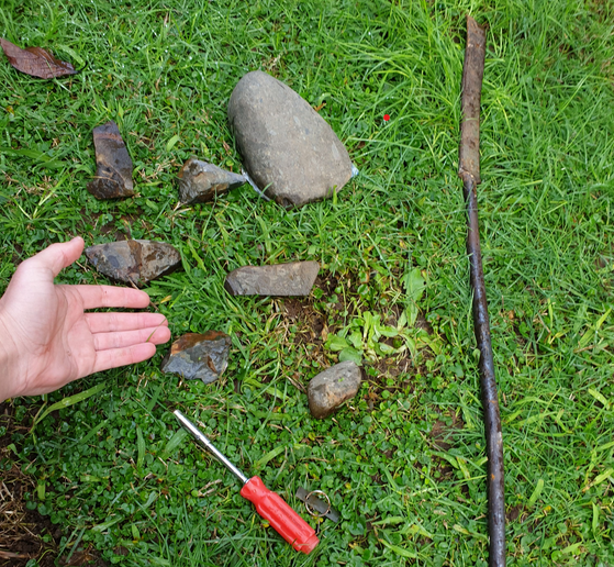 Rocks that were hurled on to the man's property and weapons used to vandalise his perimeter fence. Photo / Supplied