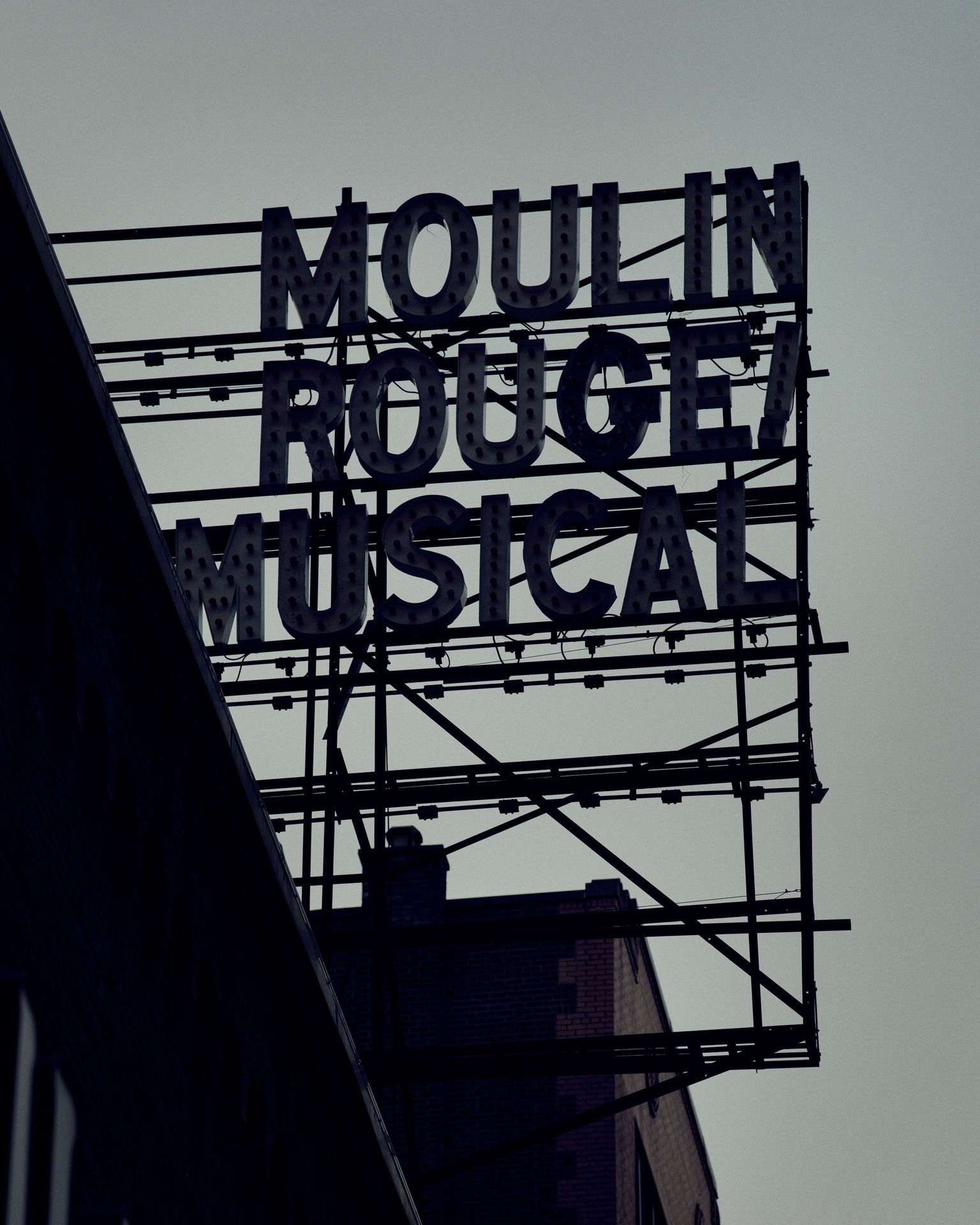The darkened Moulin Rouge! marquee at the Al Hirschfield Theatre. Photo / Thomas Prior, The New York Times