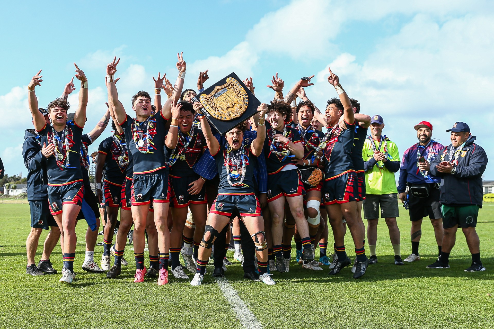 St Thomas of Canterbury College First XIII celebrate winning the National Secondary Schools title for the second year running. Photo / NZRL