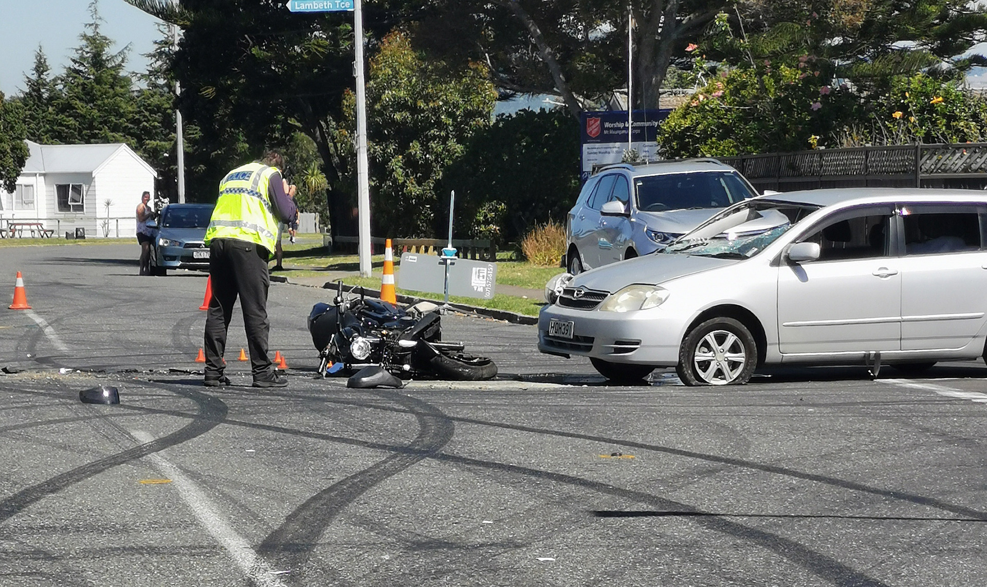 Police at the scene of a fatal crash involving a motorbike and a car near Mount Maunganui.
