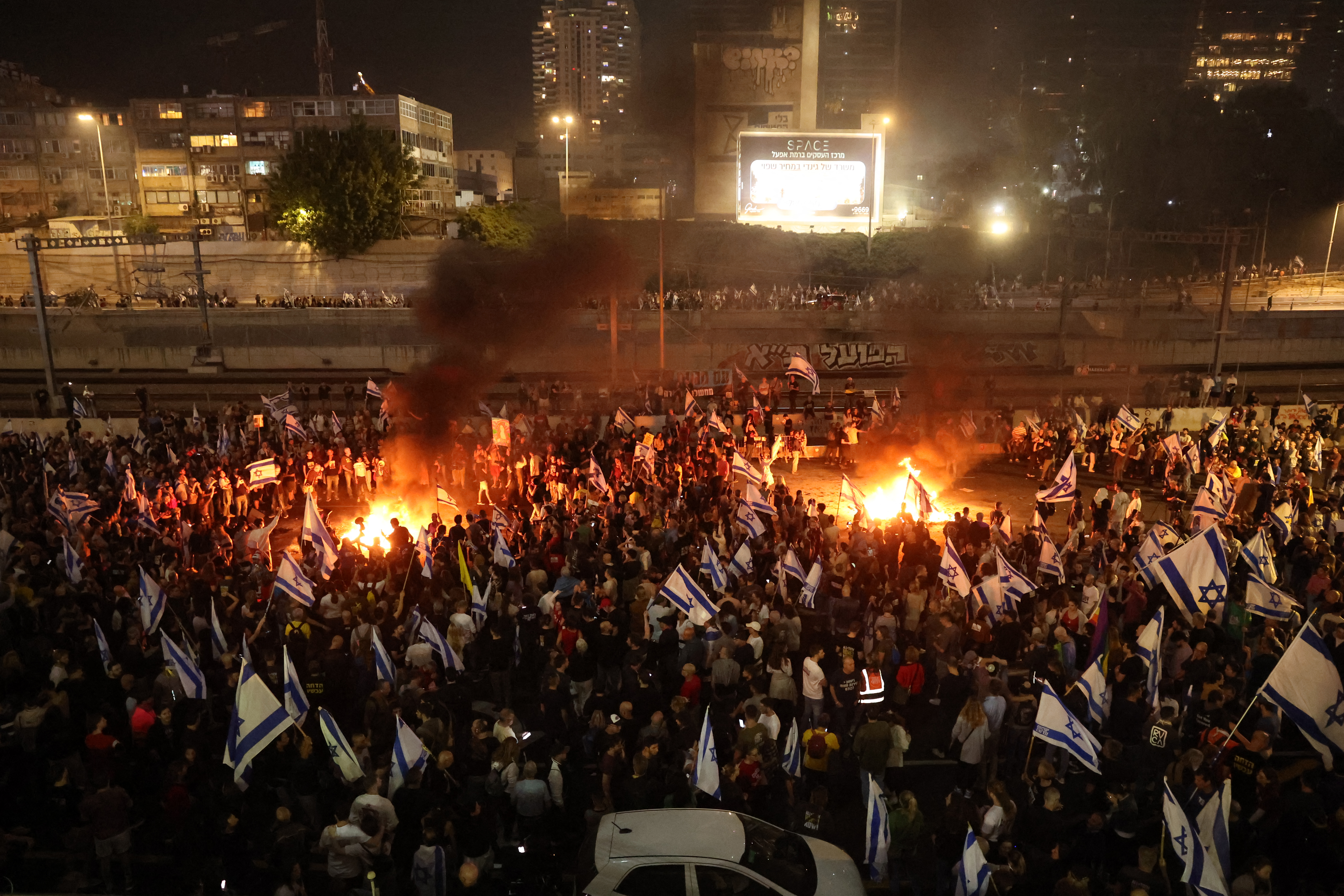 Israelis protesters block a road in Tel Aviv. Photo / AFP