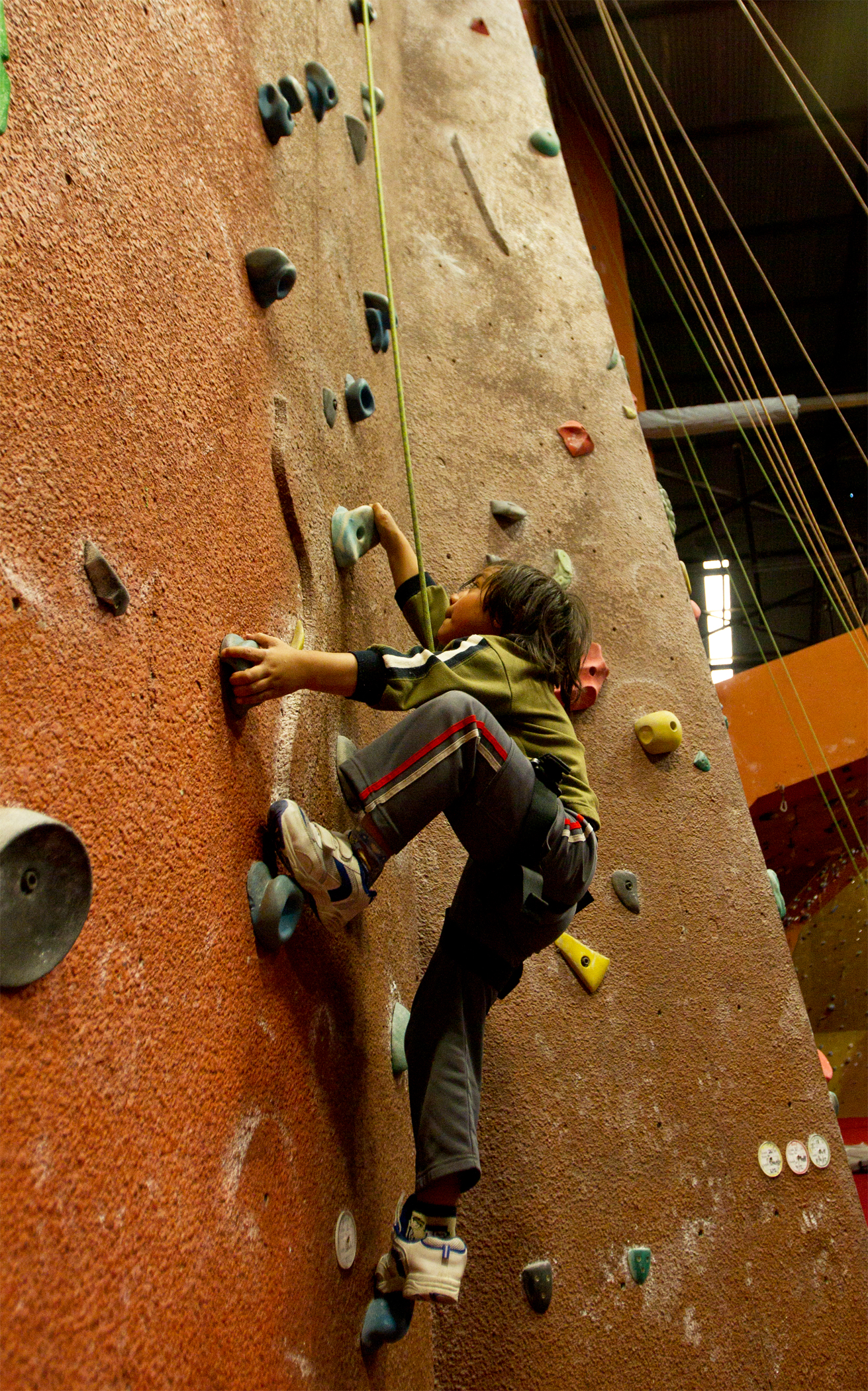 Tapu, 6, scales the wall at Extreme Edge. Photo / Kellie Blizard