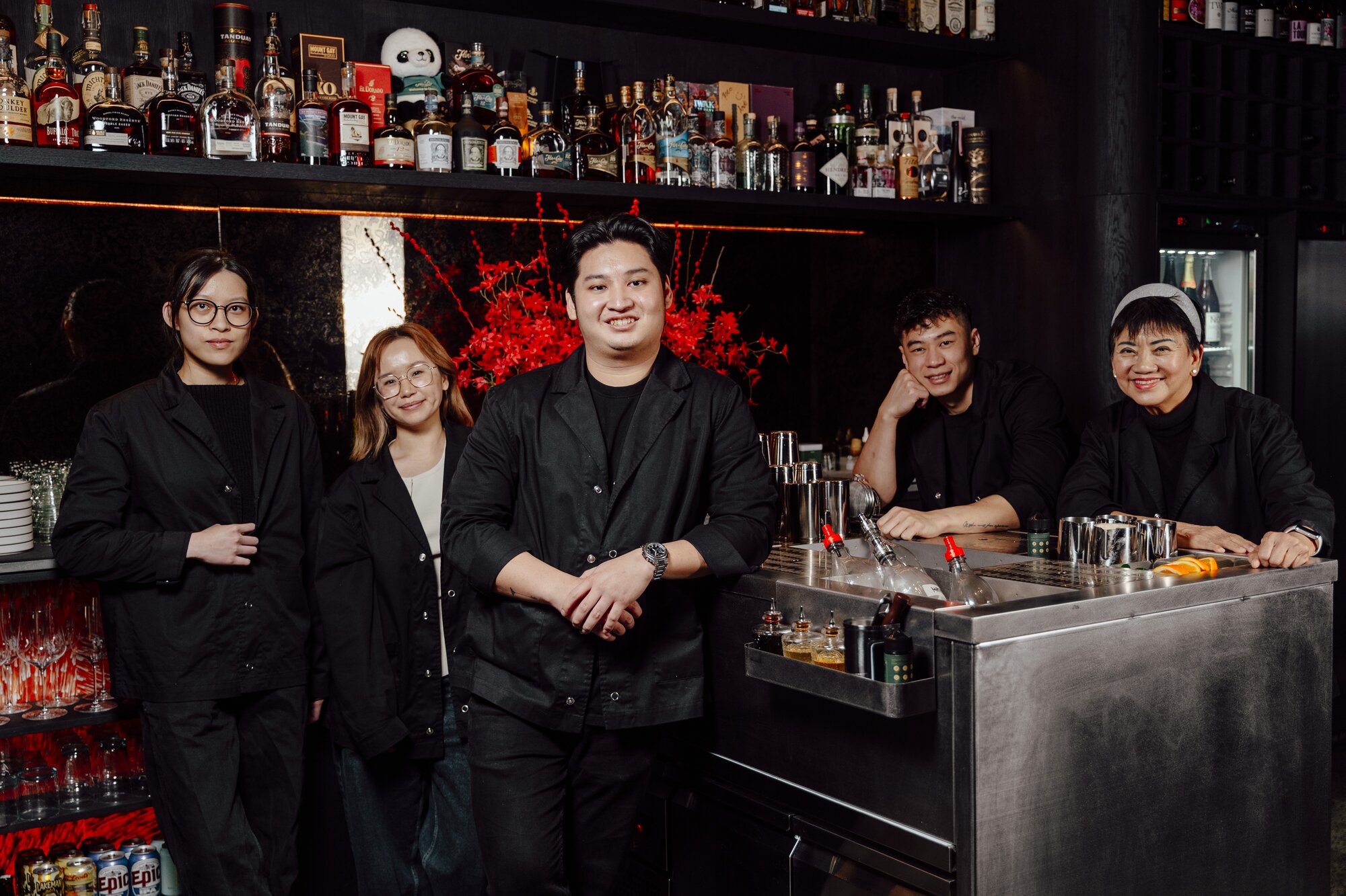 Award-winning bartender Theo Tjandra, pictured centre with his team, has opened a new cocktail bar in Auckland called Truth or Dare. Photo / PM Creatives
