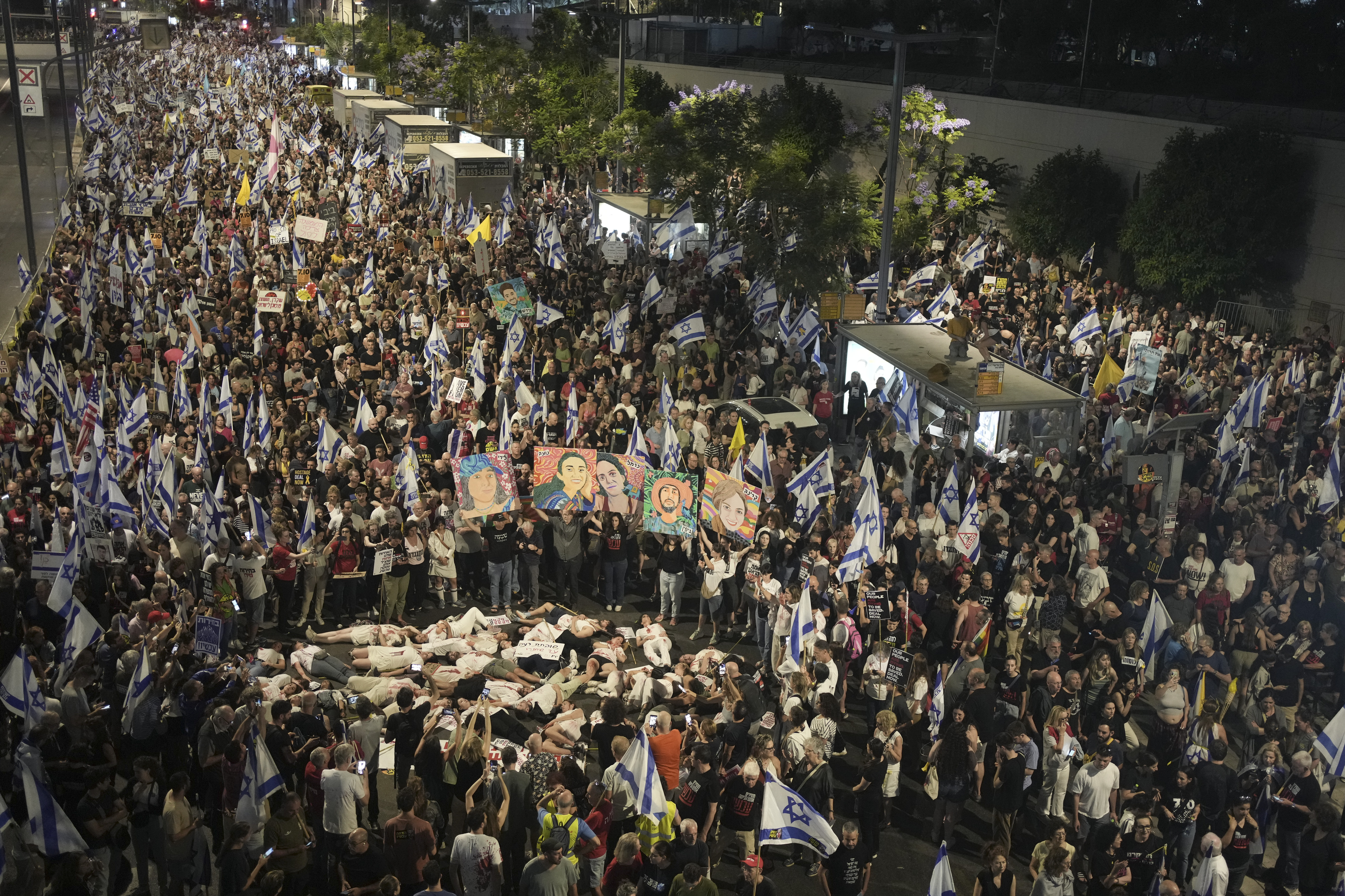 People protest against Israeli Prime Minister Benjamin Netanyahu's government and call for the release of hostages held in the Gaza Strip by the Hamas militant group, in Tel Aviv, Israel. Photo / AP