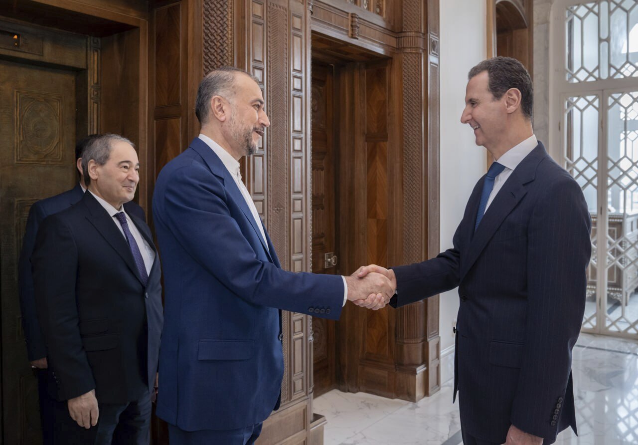 Syrian President Bashar Assad, right, welcomes Iranian Foreign Minister Hossein Amirabdollahian before their meeting in Damascus, Syria, on Monday, April 8. Iran's foreign minister on Monday accused the United States of giving Israel the