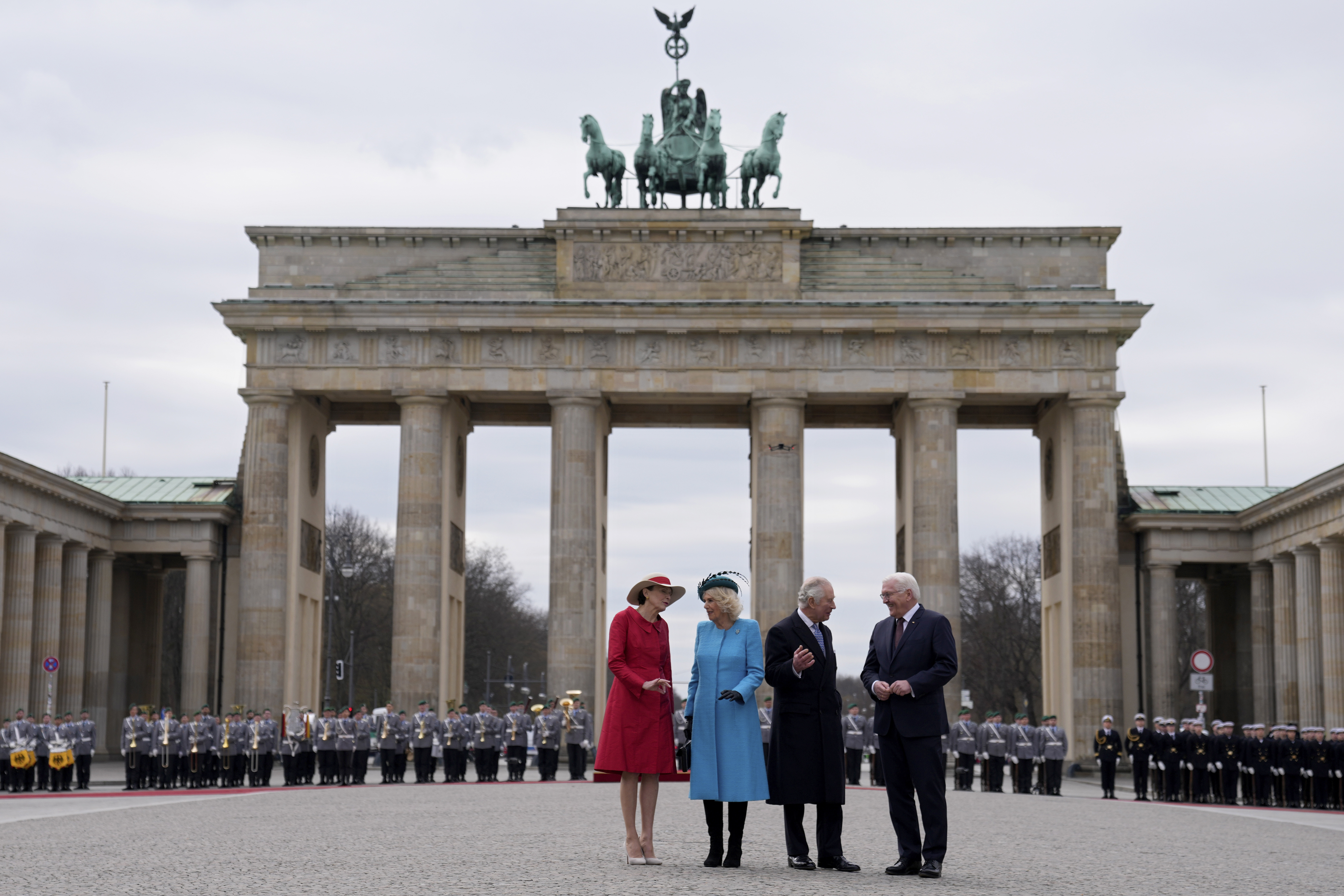 German President Frank-Walter Steinmeier (right) and his wife Elke Buedenbender (left) welcome Charles and Camilla at the Brandenburg Gate in Berlin in March. Photo / AP