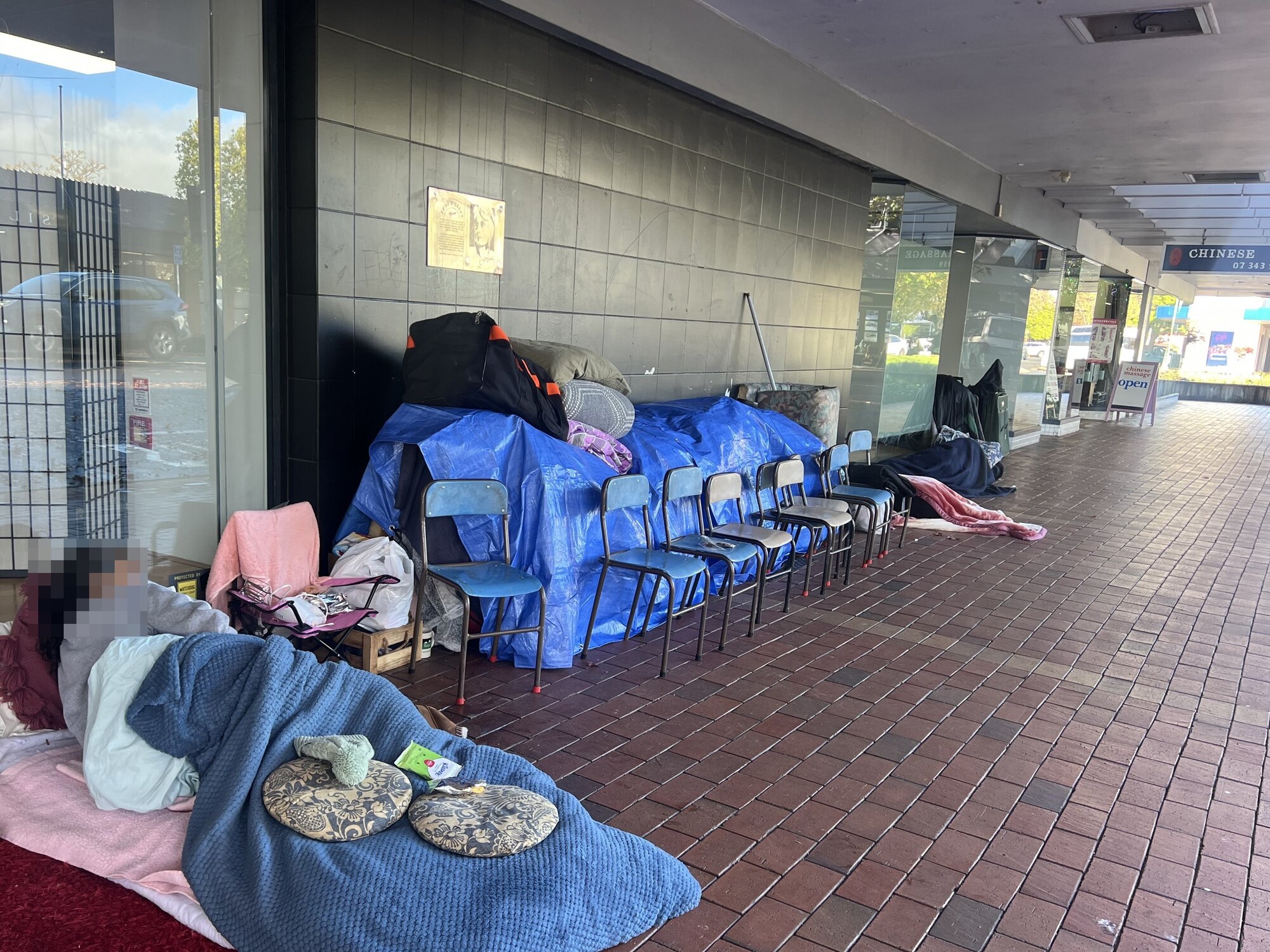  The homeless and their possessions outside the Salvation Army store on Amohia St. Photo / Kelly Makiha
