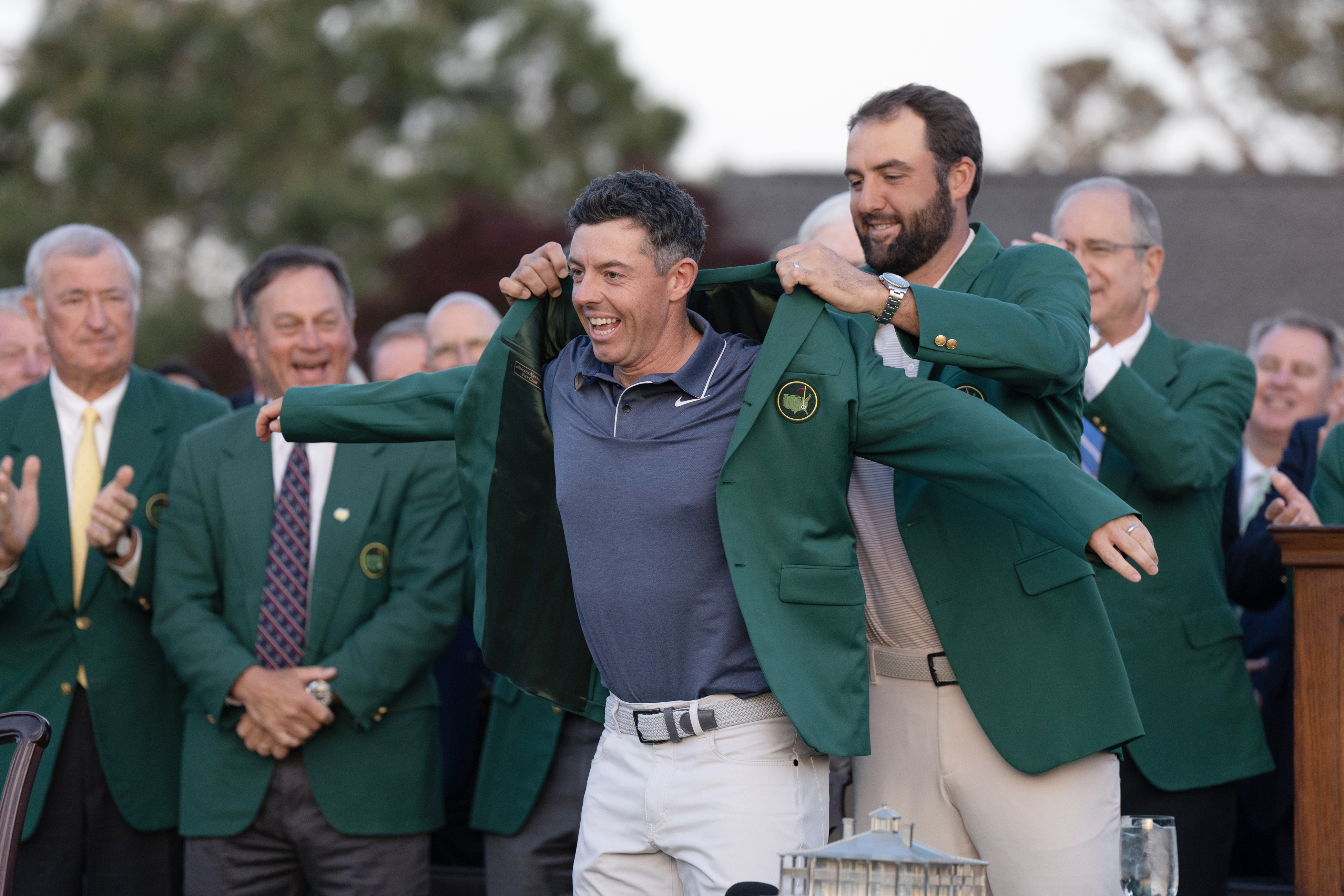 Rory McIlroy receives the green jacket from Scottie Scheffler after winning the 2025 Masters at Augusta. Photo / Getty Images