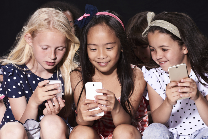 Social media warning labels and school cellphone bans: Do they unlock better youth mental health? Photo / Getty Images