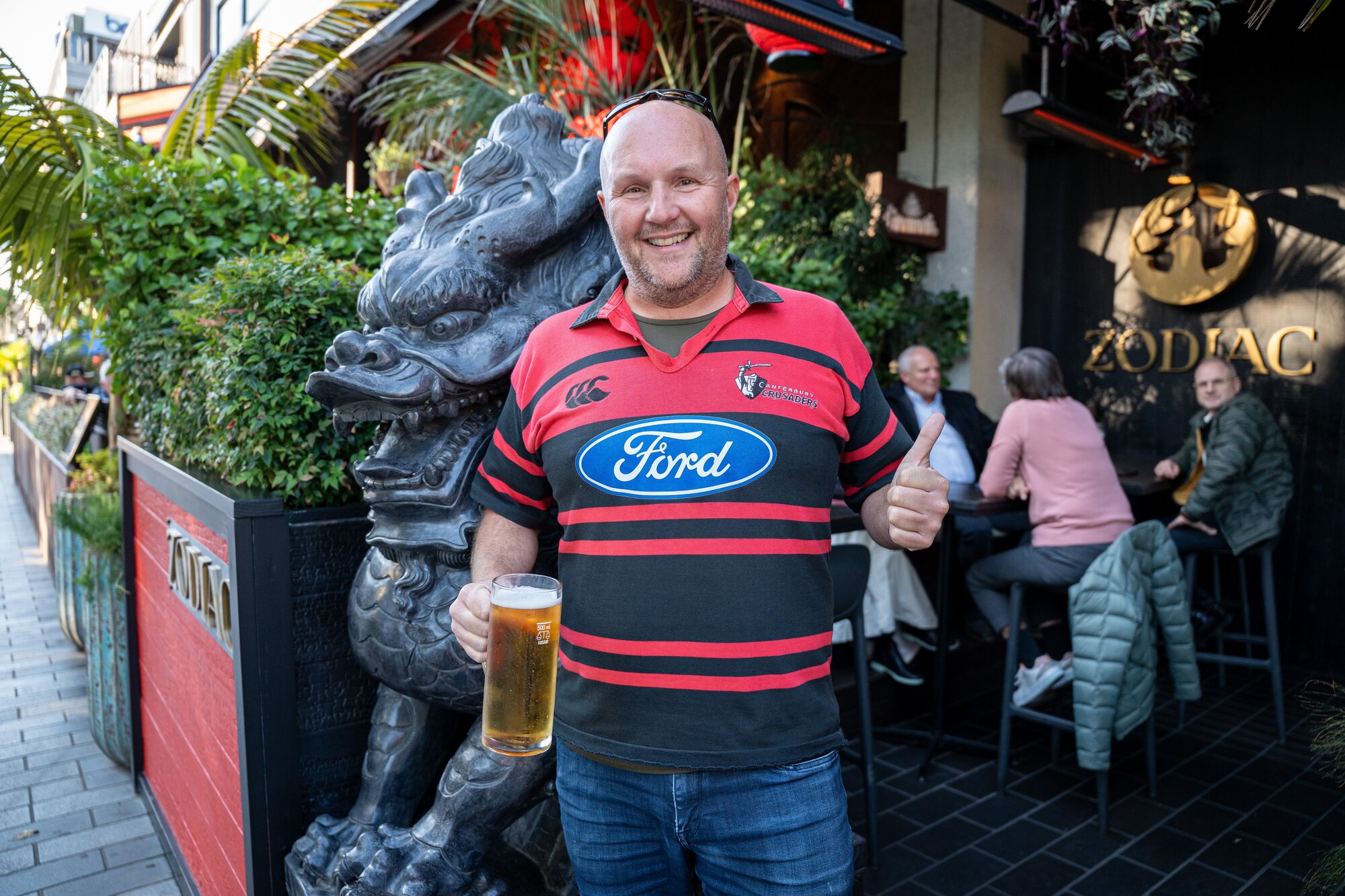 A Crusaders fan lubricates before making the walk to One NZ Stadium. Photo / Alyse Wright 