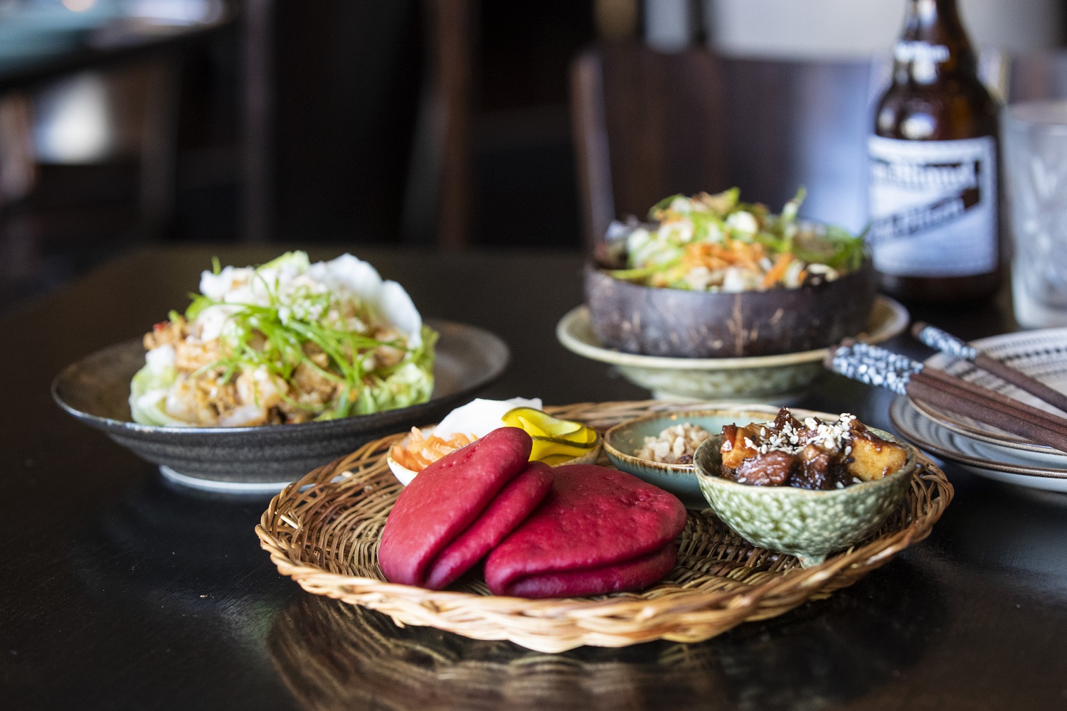 Nanam’s beetroot bao, papaya salad, and spicy pork and prawn. Photo / Jason Oxenham