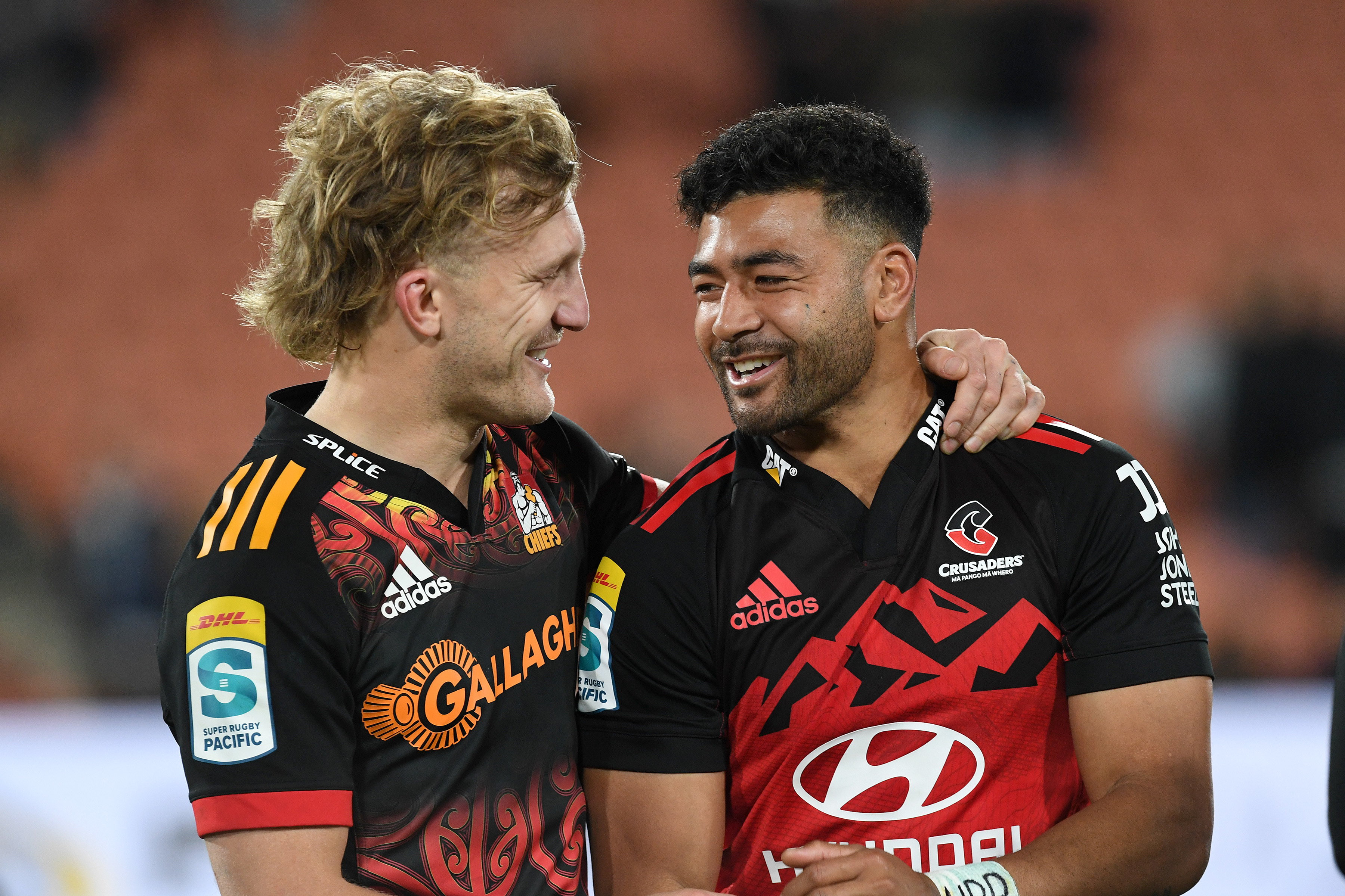 Damian McKenzie of the Chiefs (left) and Richie Mo'unga of the Crusaders. Their friendship and rivalry is set to continue. Photo / Photosport