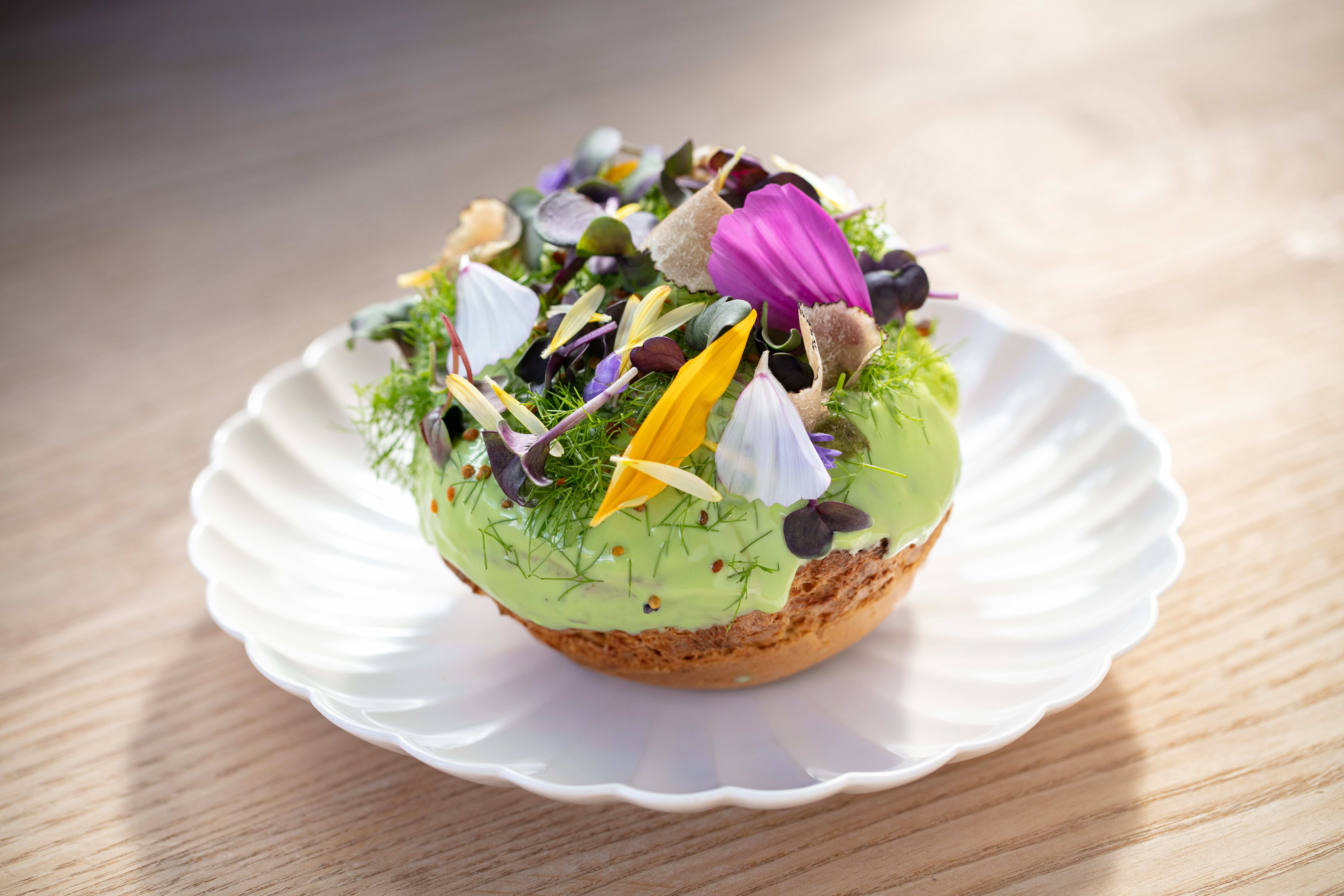 Alpha's spring puff, an eclair-like structure filled with an intriguing mix of vanilla mouse, herbs and white chocolate. Photo / Babiche Martens
