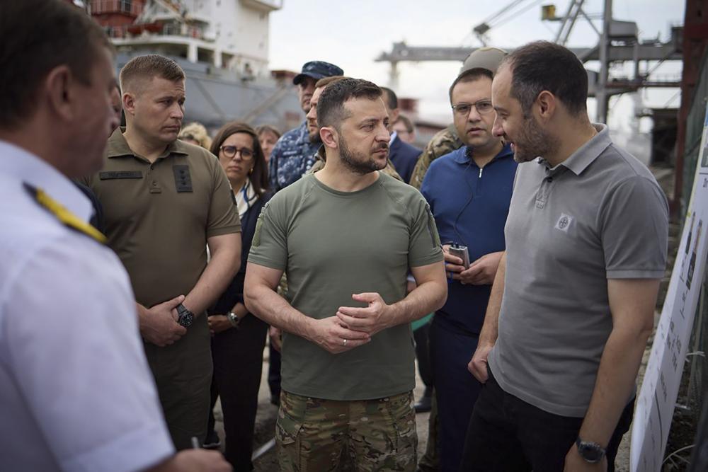 Ukrainian President Volodymyr Zelenskyy (centre), surrounded by ambassadors of different countries and UN officials, visits a port in Chornomork during loading of grain on a Turkish ship. Photo / AP