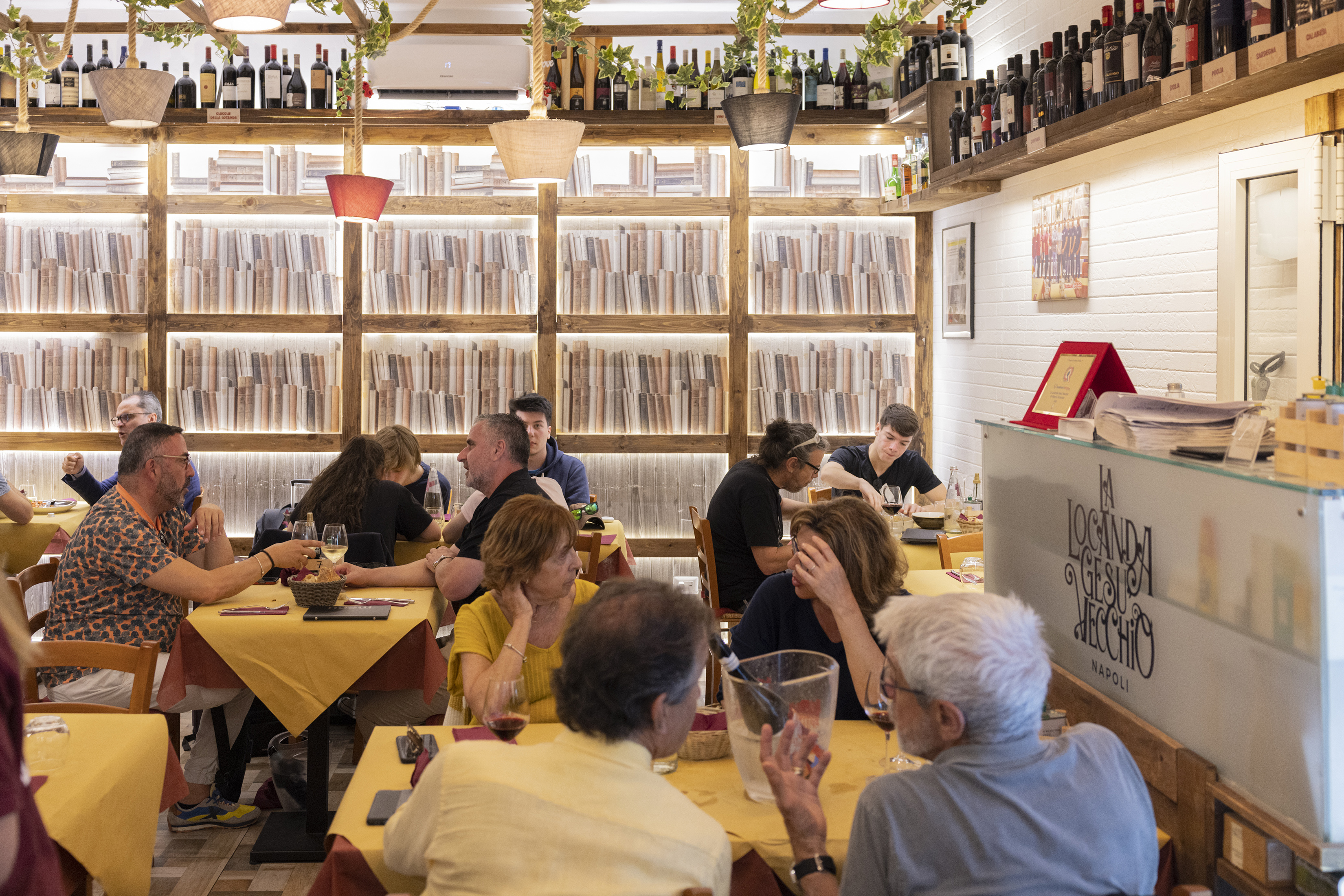 Patrons eat at La Locanda Gesu Vecchio, in the historic centre of Naples. Photo / Roberto Salomone, The New York Times