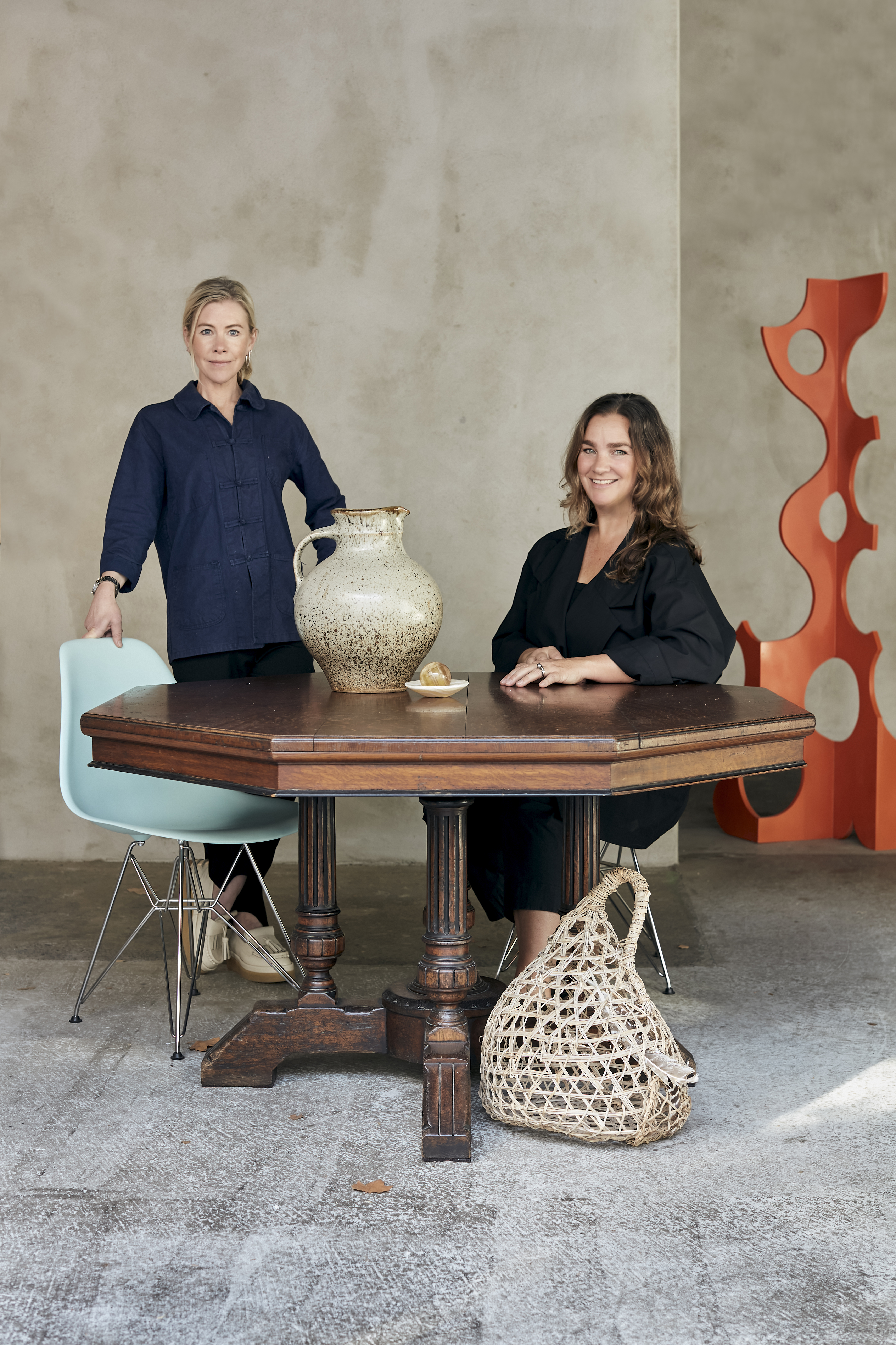 My Exhibition founders Sara Bruce and Sophie Fearon with special vintage pieces from their Parnell store, including an orange sculpture by local artist Grant Gallagher. Photo / Babiche Martens