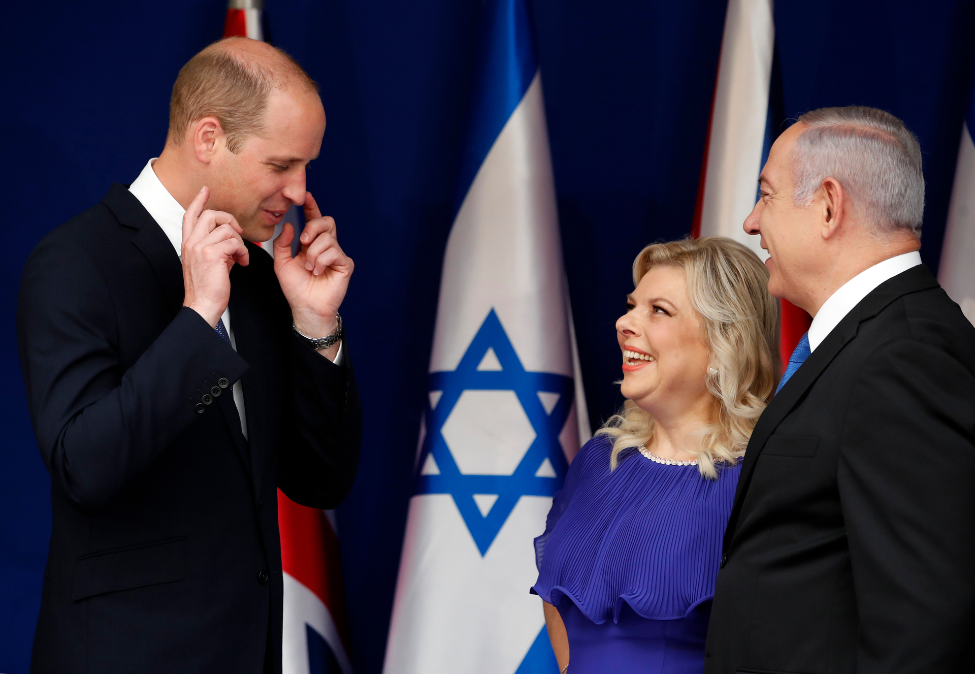 Britain's Prince William, left, meets with Israel Prime Minister Benjamin Netanyahu and his wife Sara in Jerusalem. Photo / AP