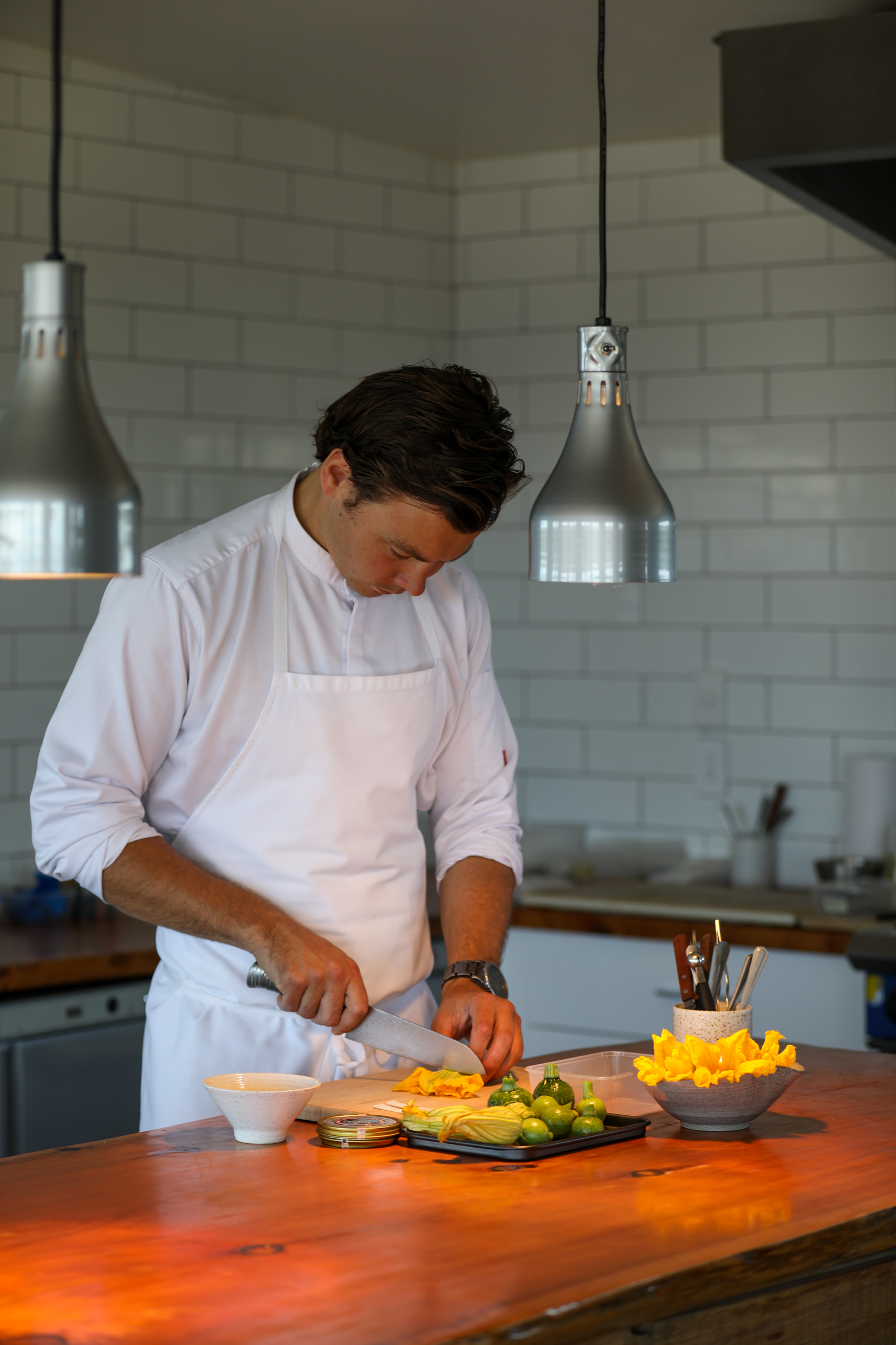Chef Jack Cashmore at the central island of The Chef's Table restaurant. Photo / Orianna Photography