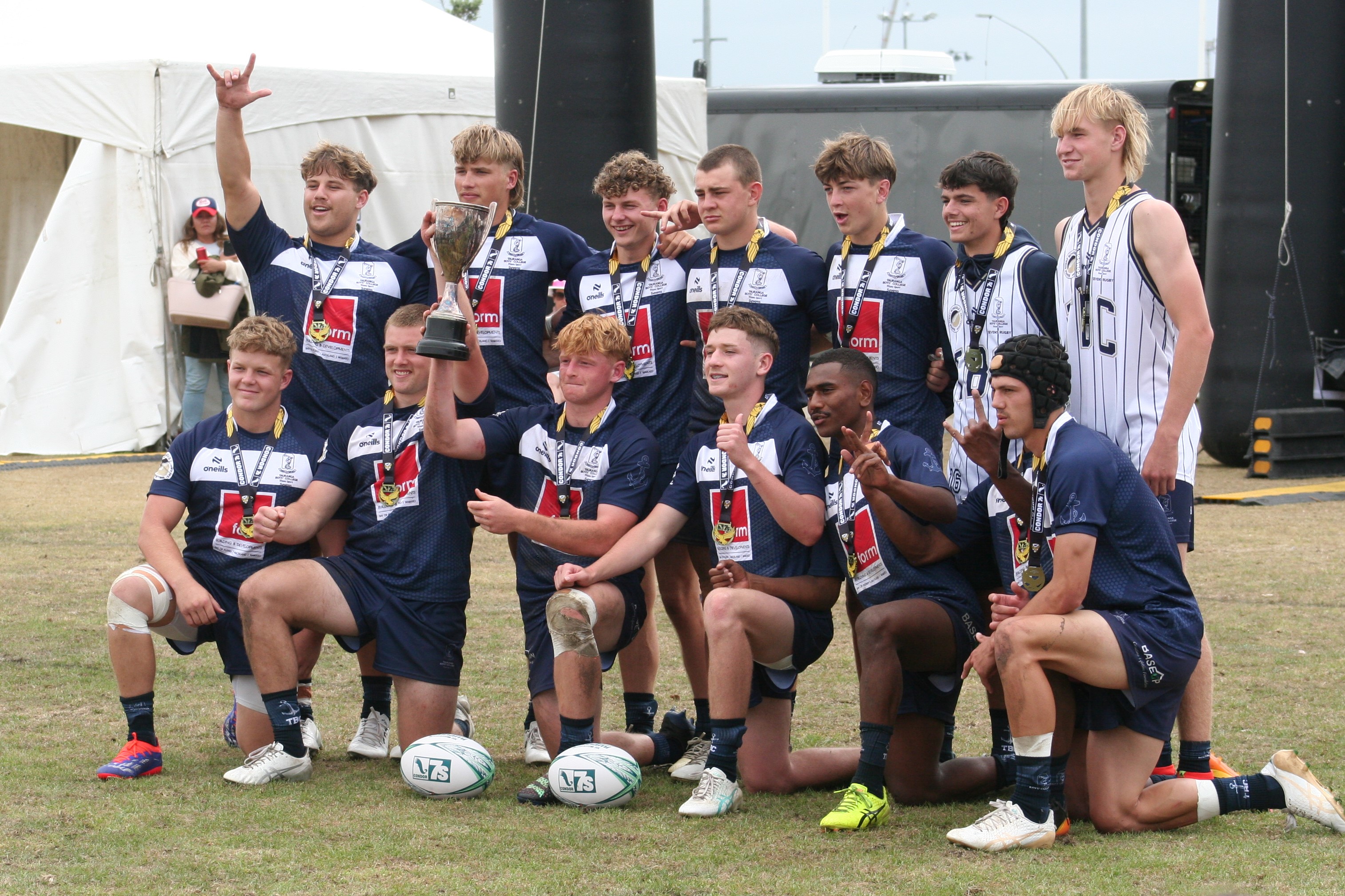 The Tauranga Boys' College team photo with the trophy.