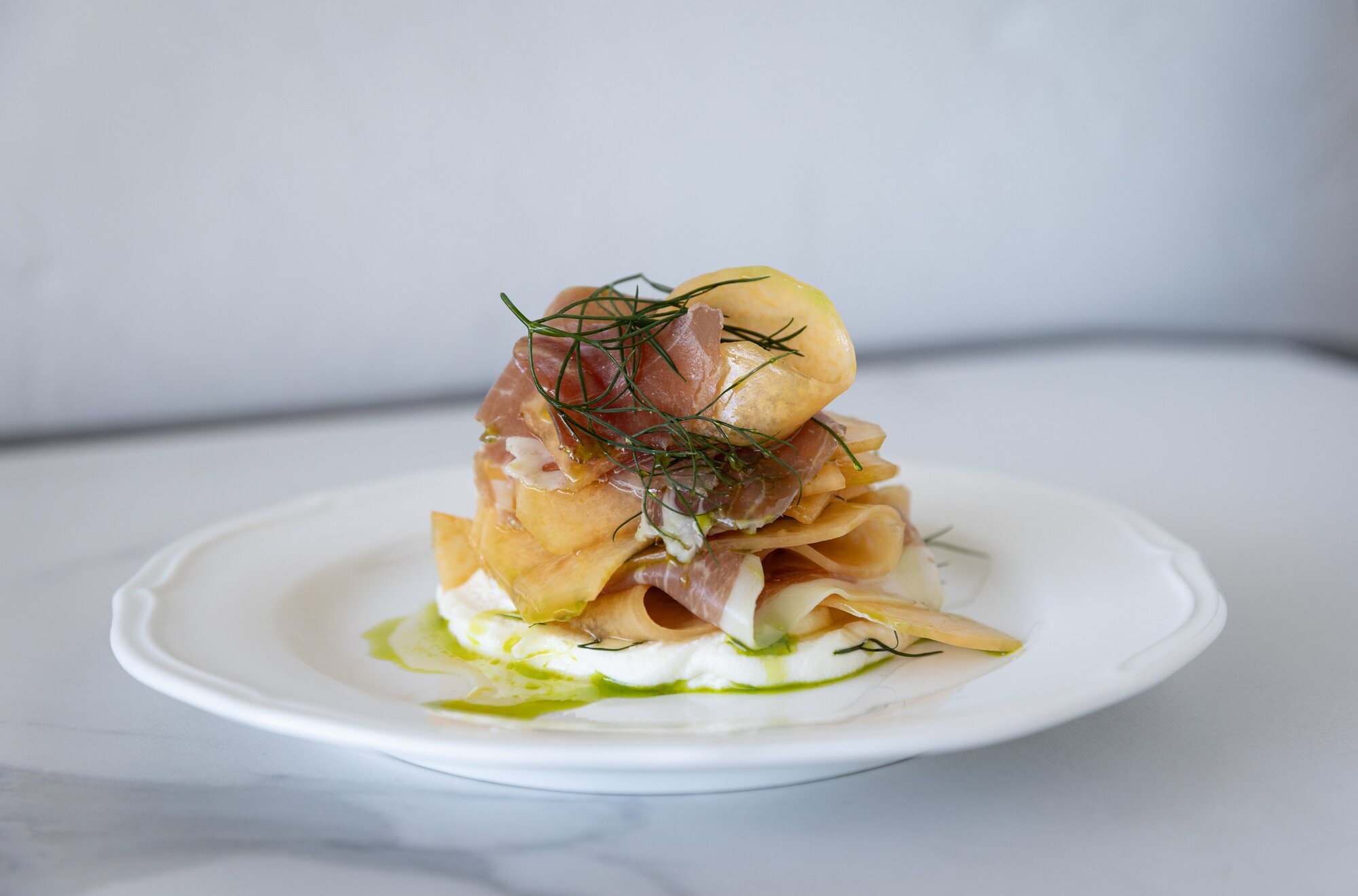 The melon prosciutto with whipped ricotta, honey, basil and dill, from Northcote Point's new restaurant, Sfera. Photo / Dean Purcell