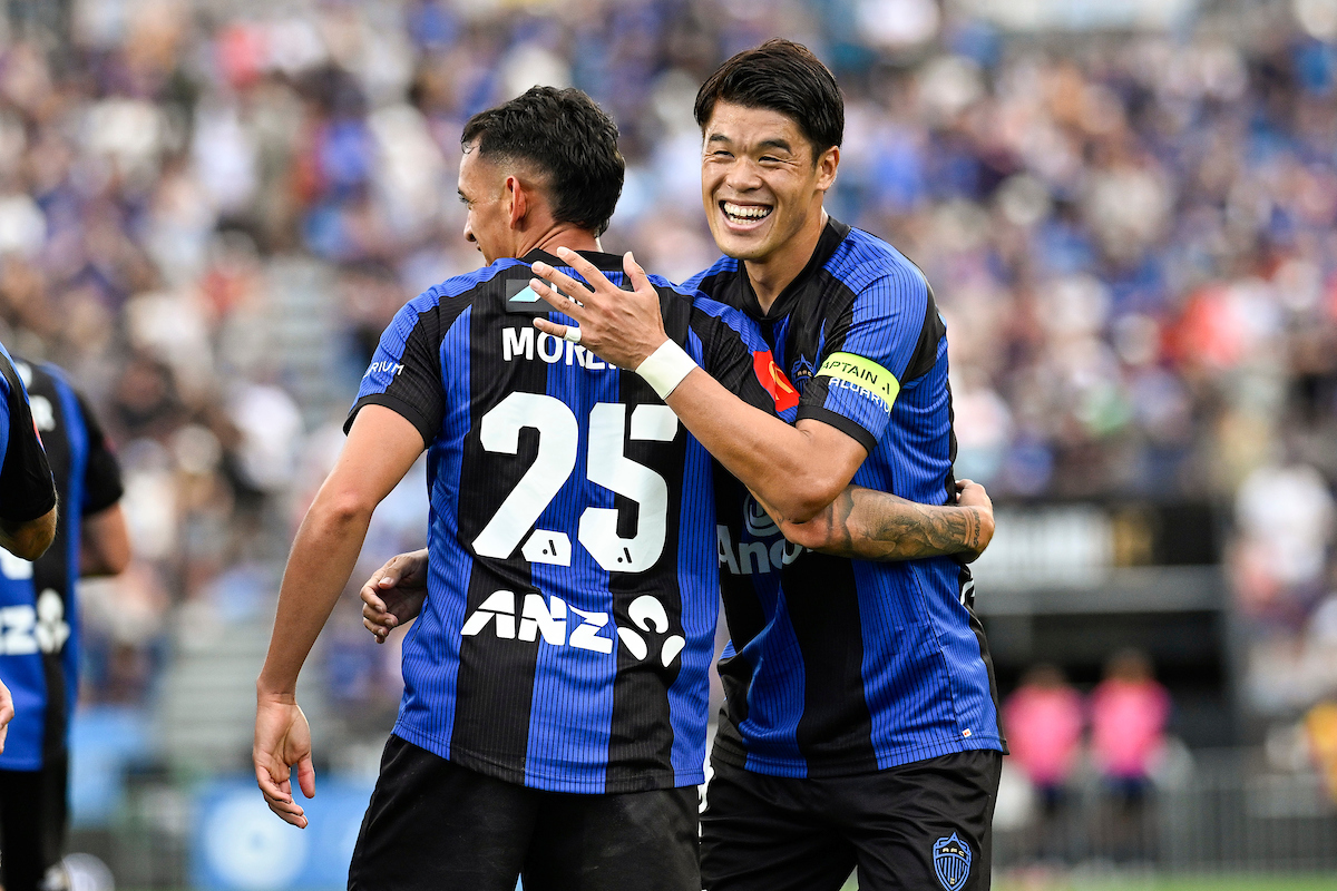 Hiroki Sakai of Auckland FC congratulates Neyder Moreno on his goal against the Wellington Phoenix. Photo / Photosport