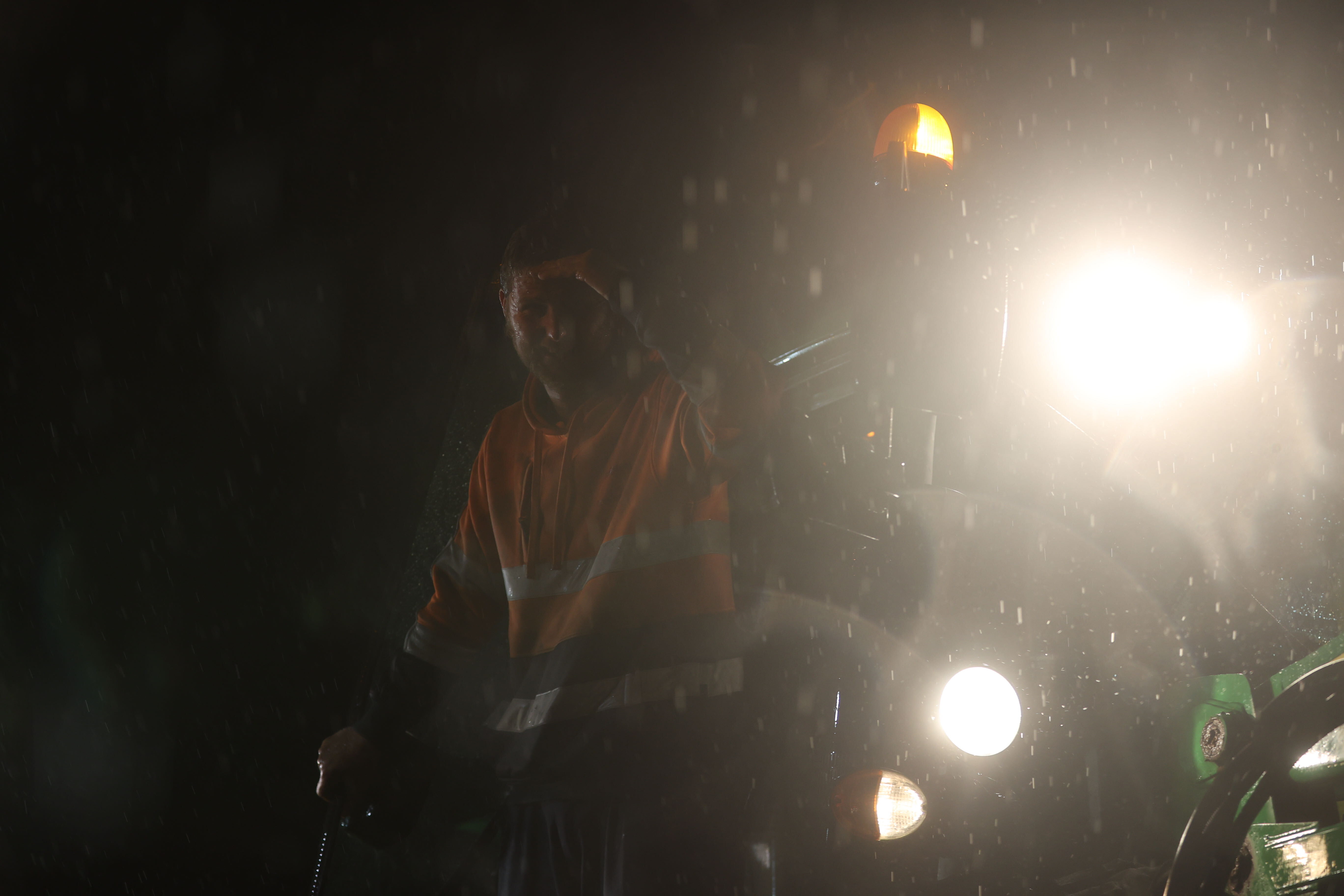 Fire crews on the scene rescuing multiple families from flood-stricken Dale Road, Ramarama. Photo / George Heard